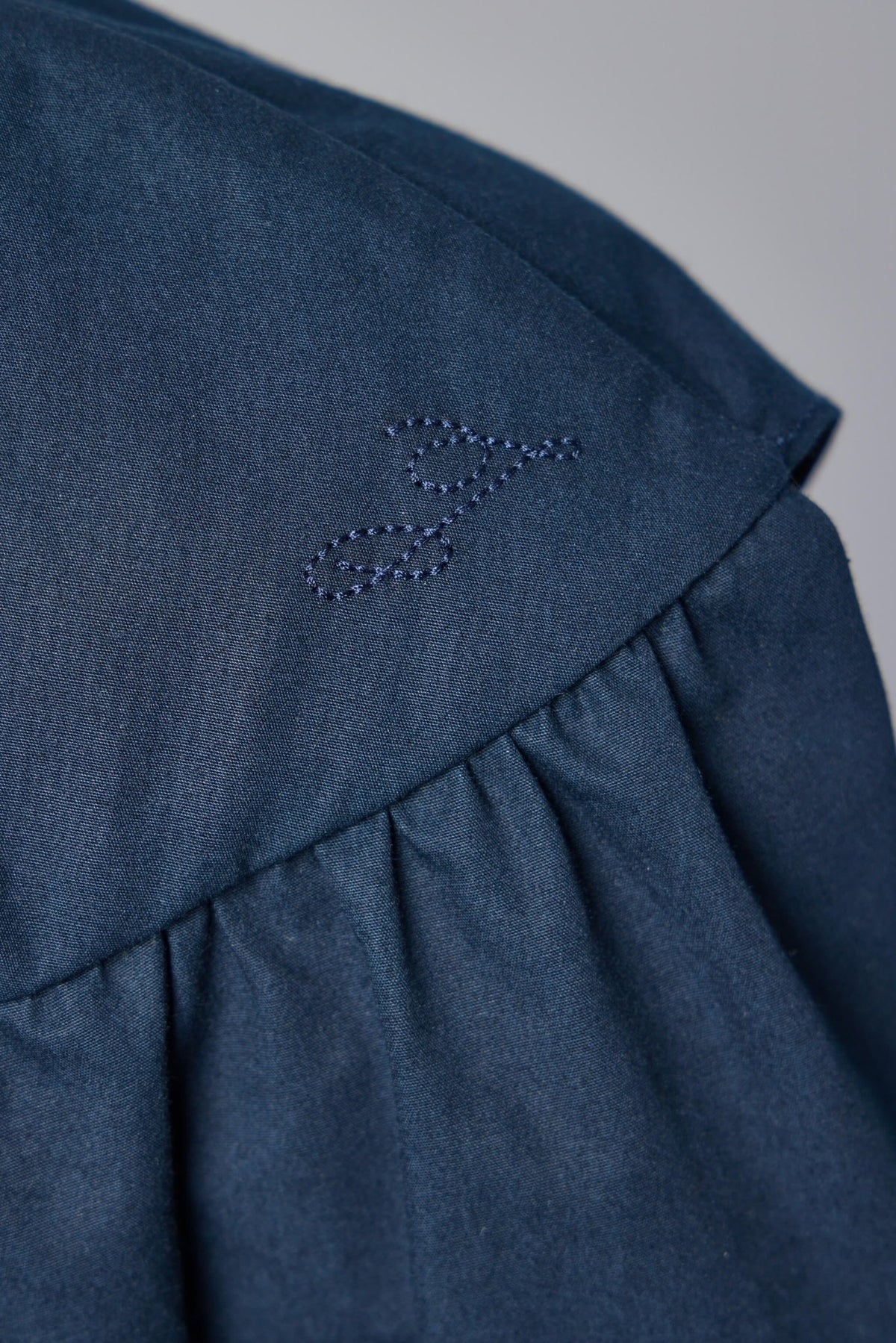 Navy blue mini dress styled with contemporary accessories, view 5
