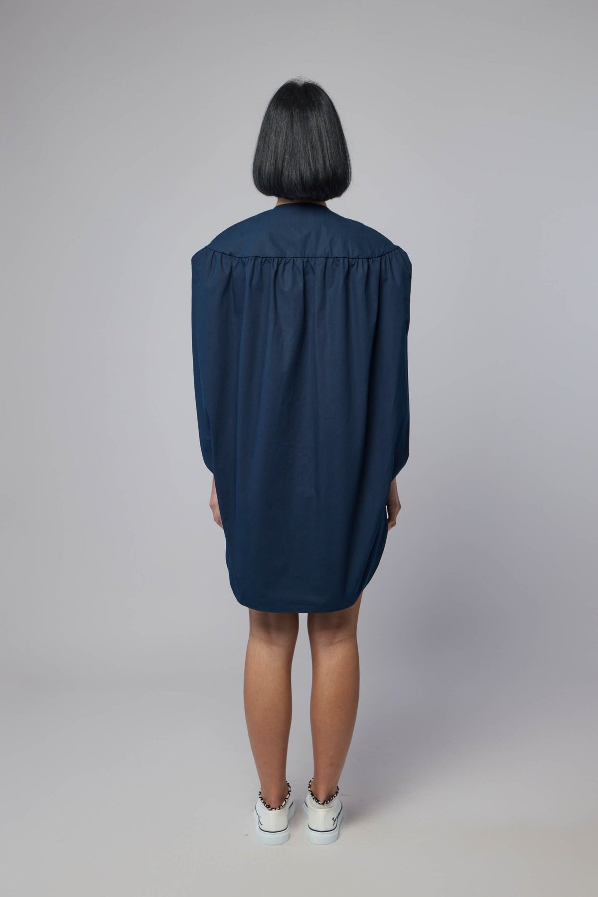 Navy blue mini dress styled with contemporary accessories, view 7