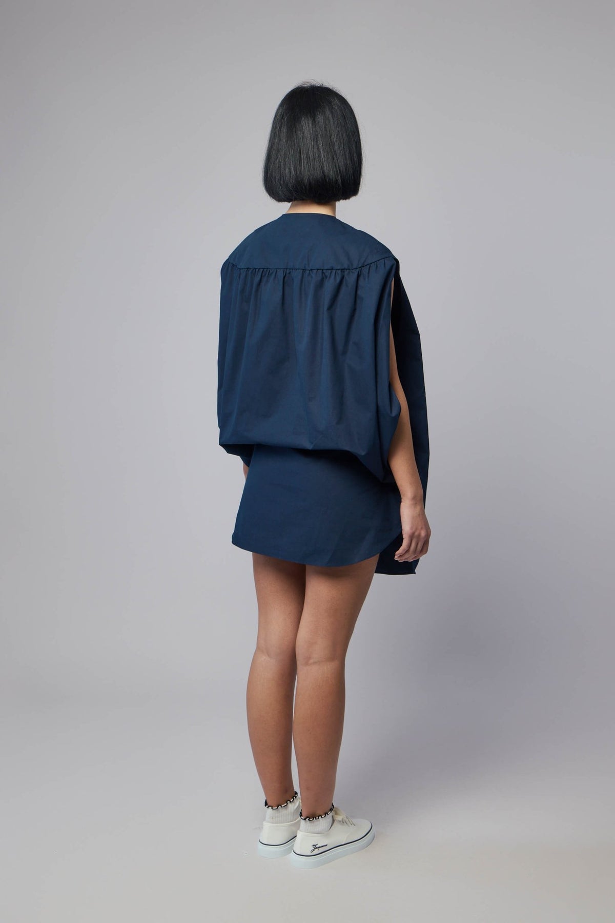 Navy blue mini dress styled with contemporary accessories, view 6