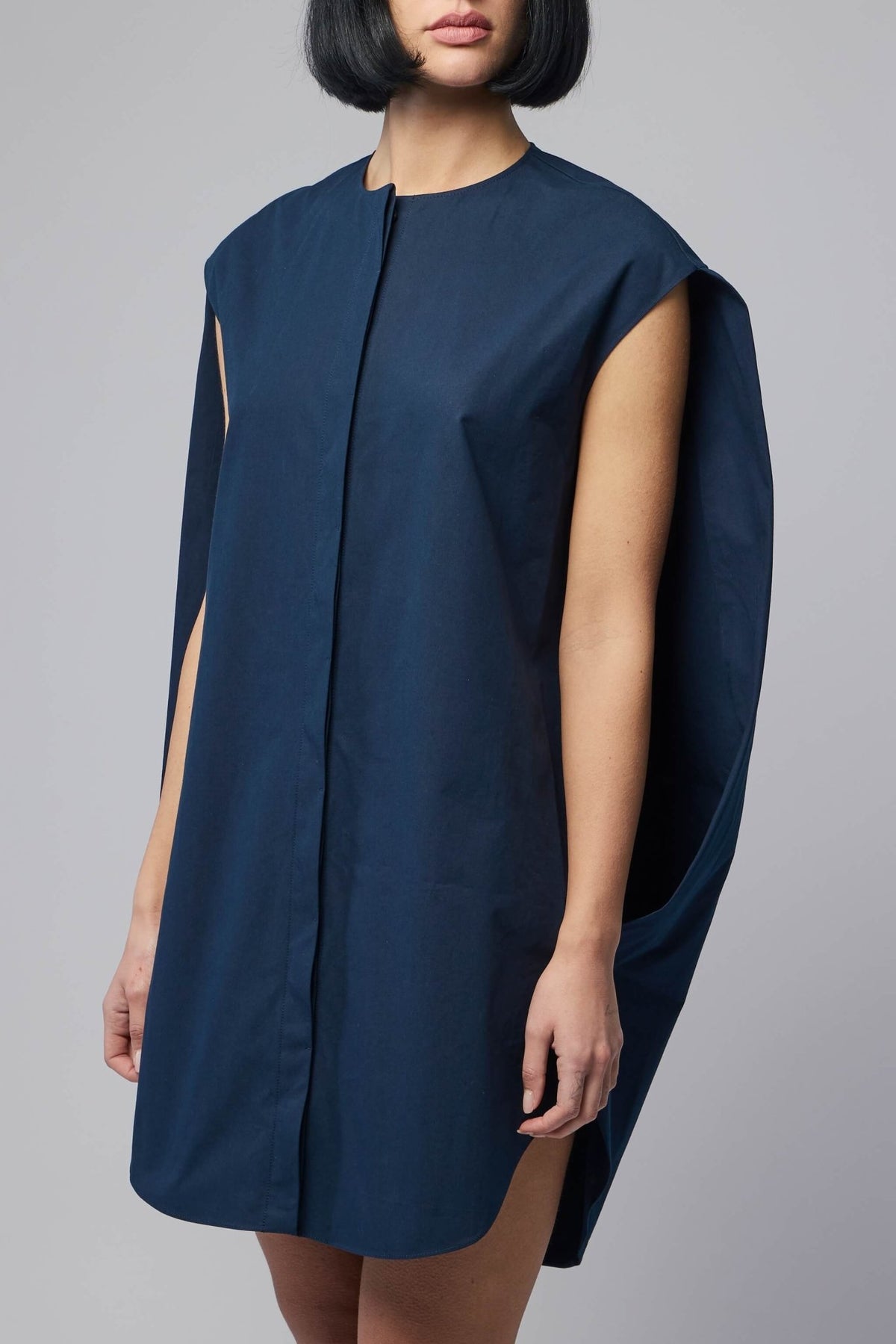 Back view of structured mini dress showing clean silhouette