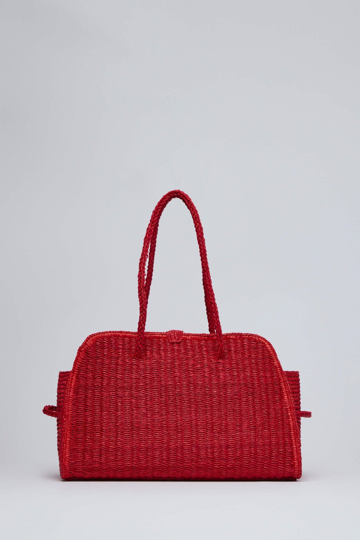 Top-handle design of Le Turismo Raphia clutch showing elegant proportions