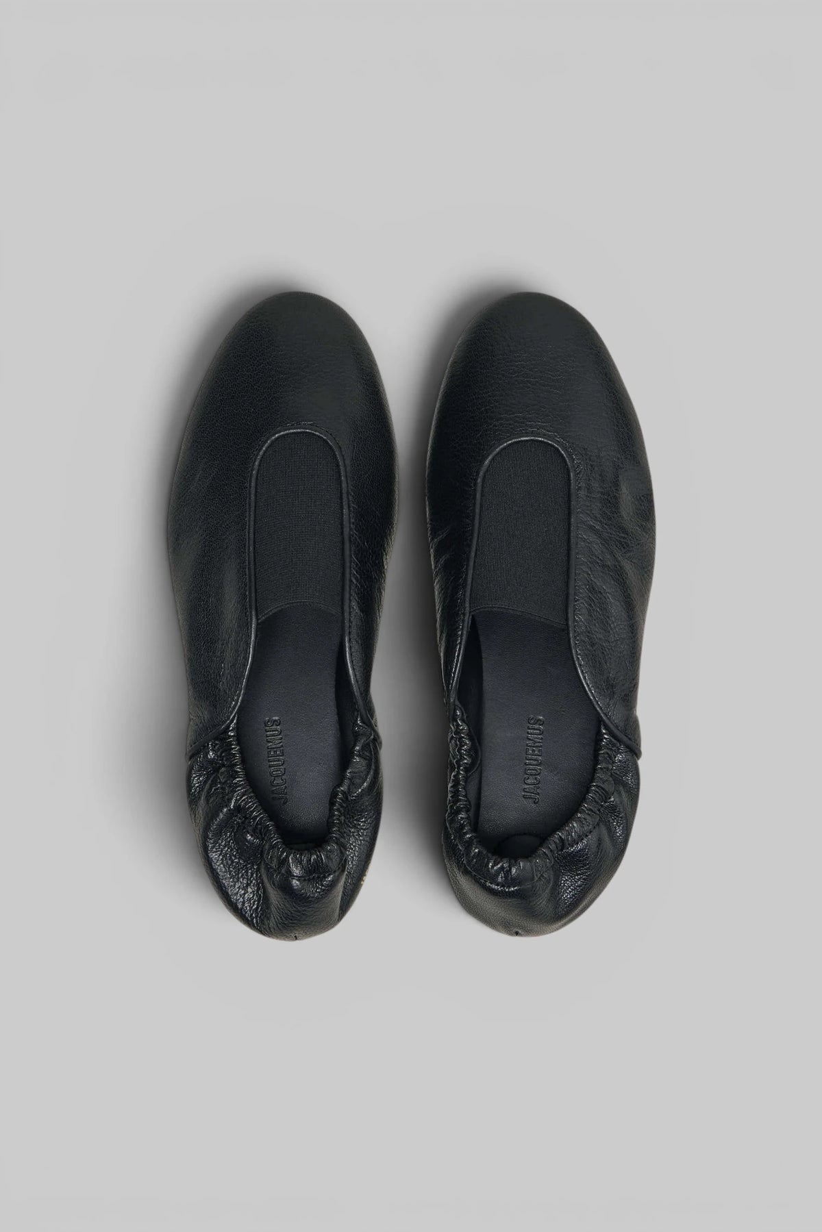 Close-up of smooth upper and subtle seam detailing on Jacquemus Flats