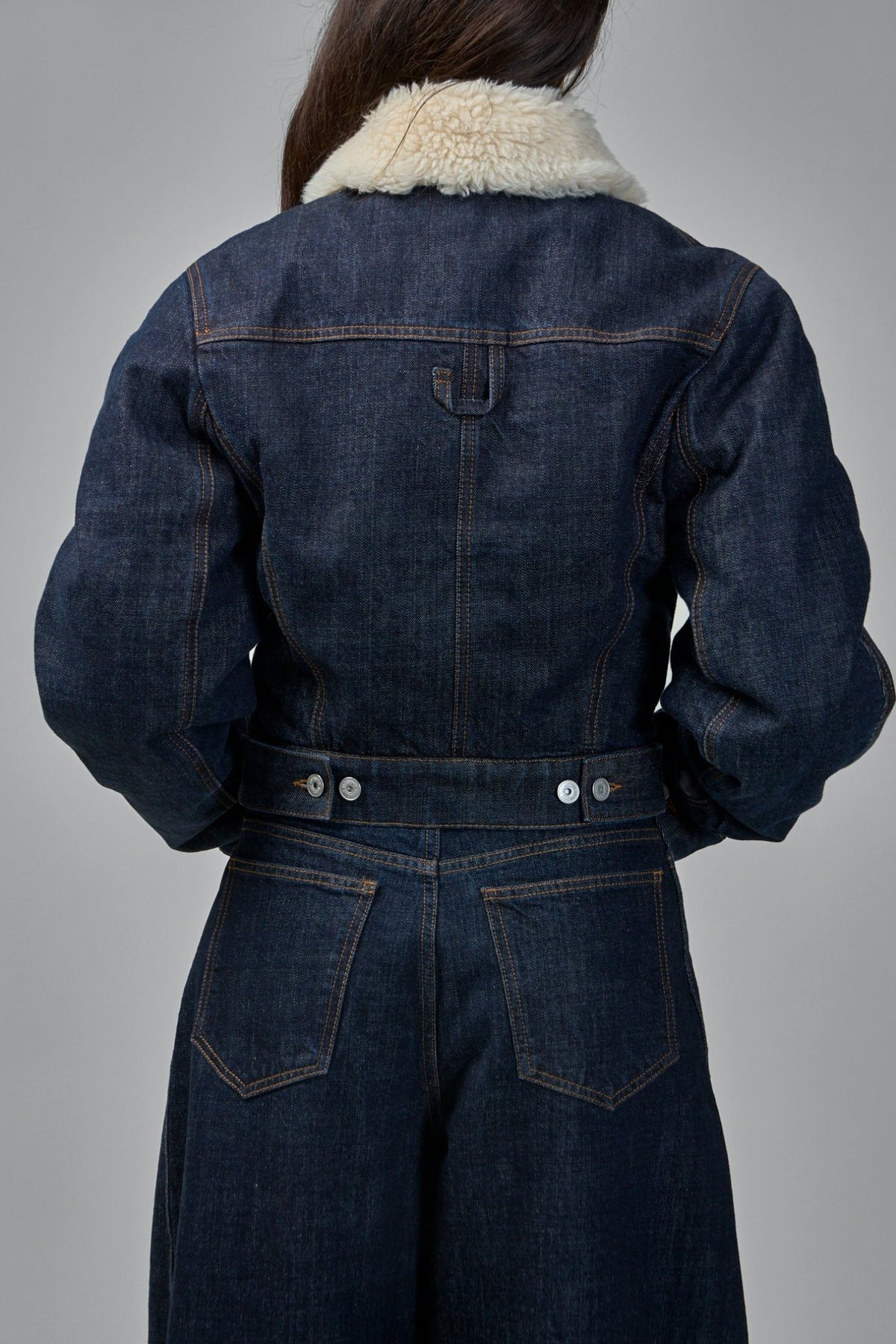 Model wearing Jacquemus Ovalo de-Nîmes Denim Jacket with boxy fit