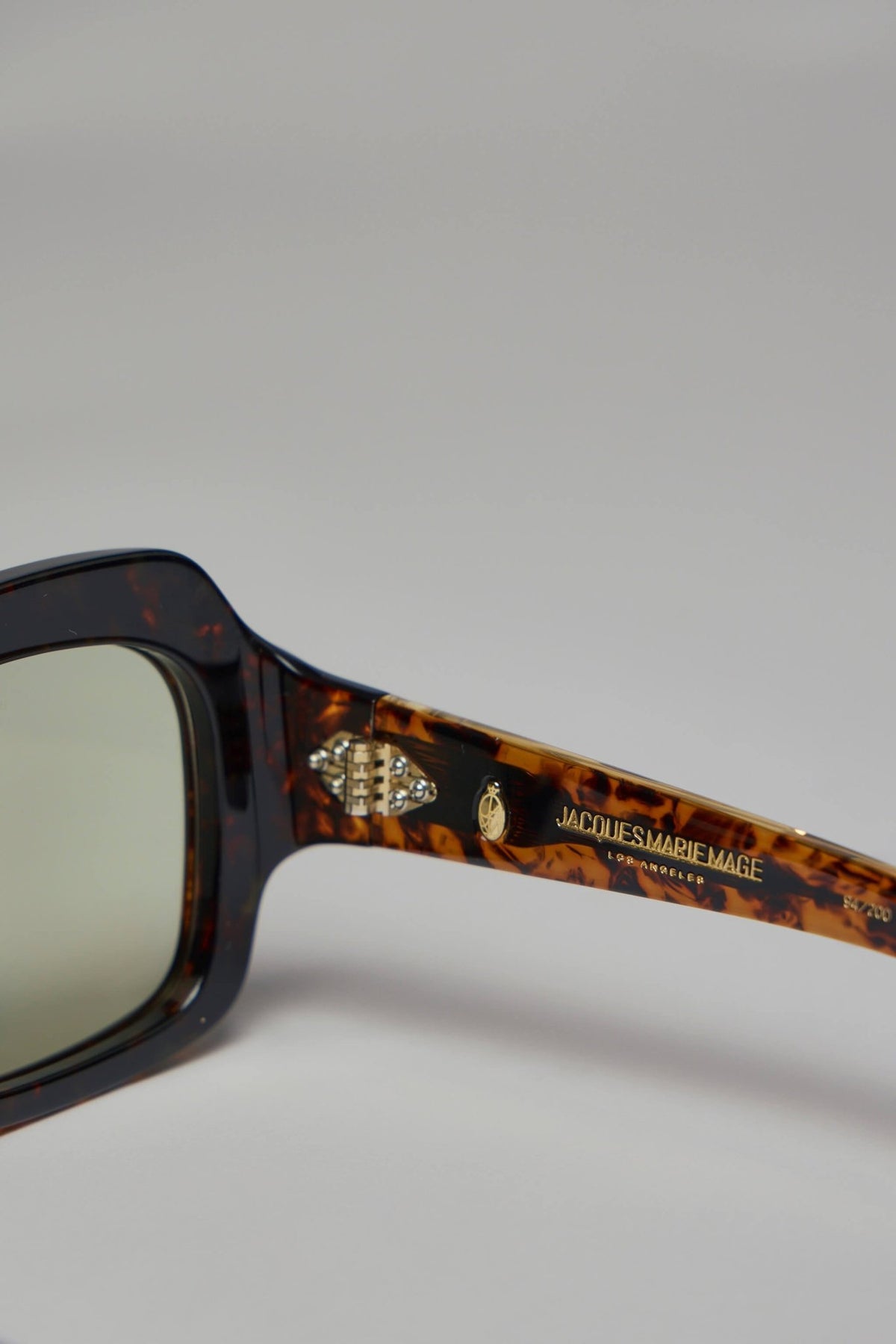 Jacques Marie Mage sunglasses displayed on neutral background showing lens gradient, view 6