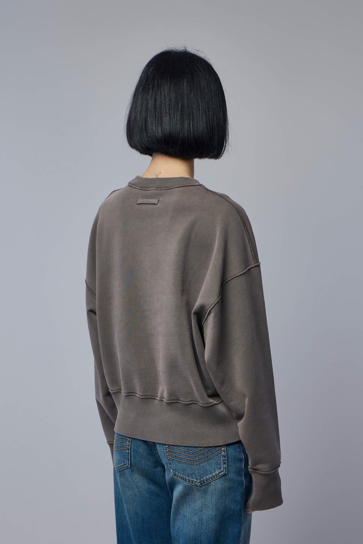 Back view of Jean Paul Gaultier embroidered sweatshirt with ribbed hem detail