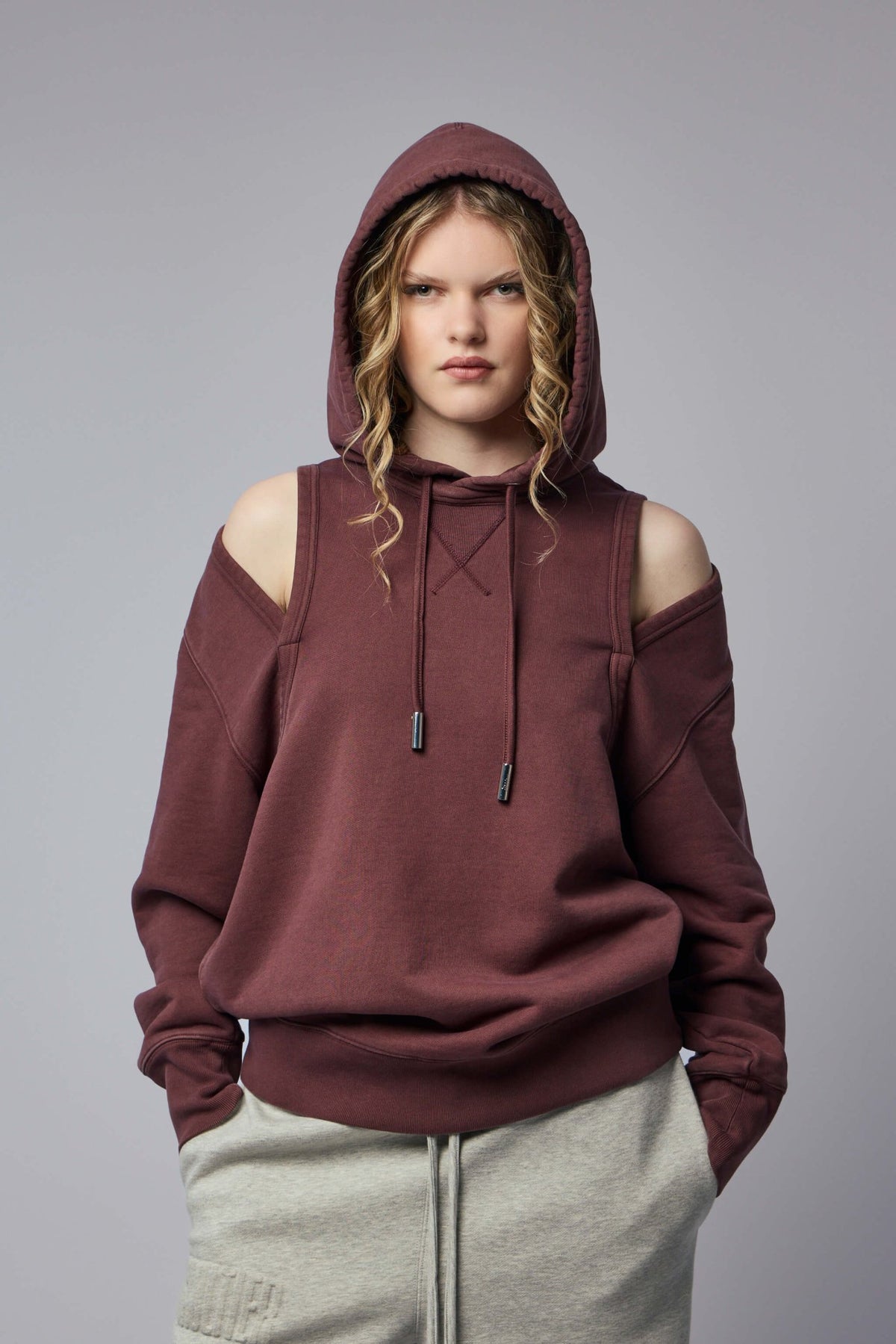 Jean Paul Gaultier hoodies with cut-out shoulder design in French terry cotton