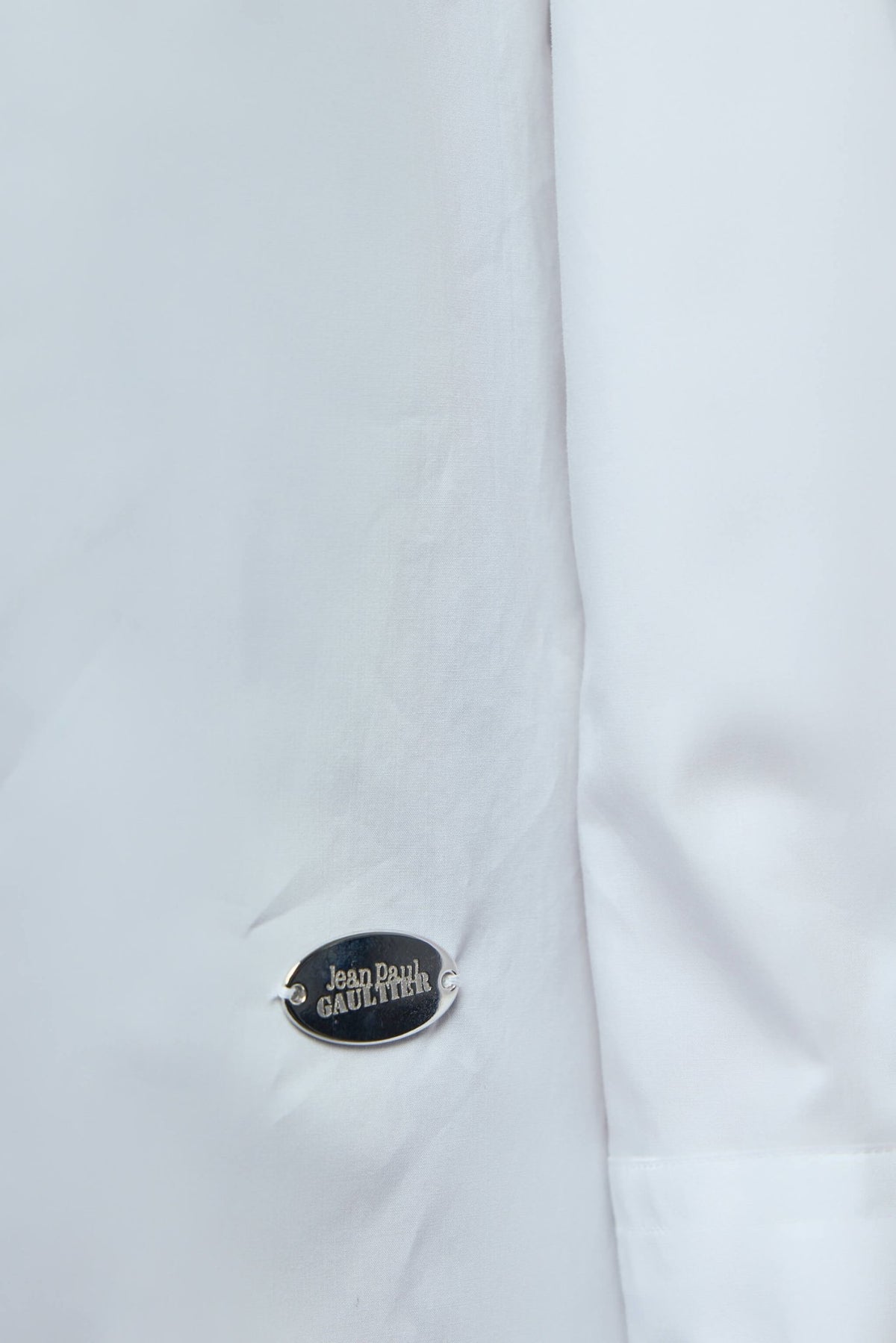 Back view of Jean Paul Gaultier shirt showing curved hem and logo detail, view 5