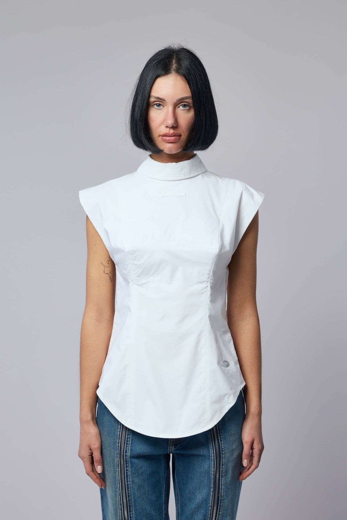 Close-up of Jean Paul Gaultier signature design details on sleeveless blouse