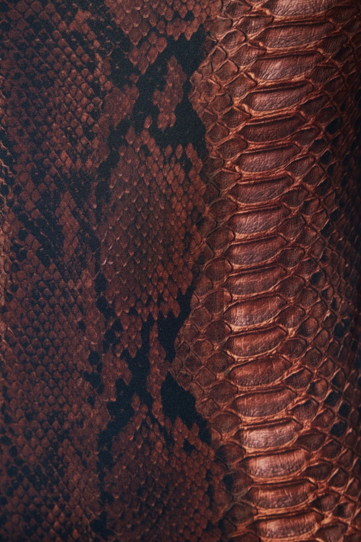 Detail shot of wide shoulder straps and figure-hugging fit