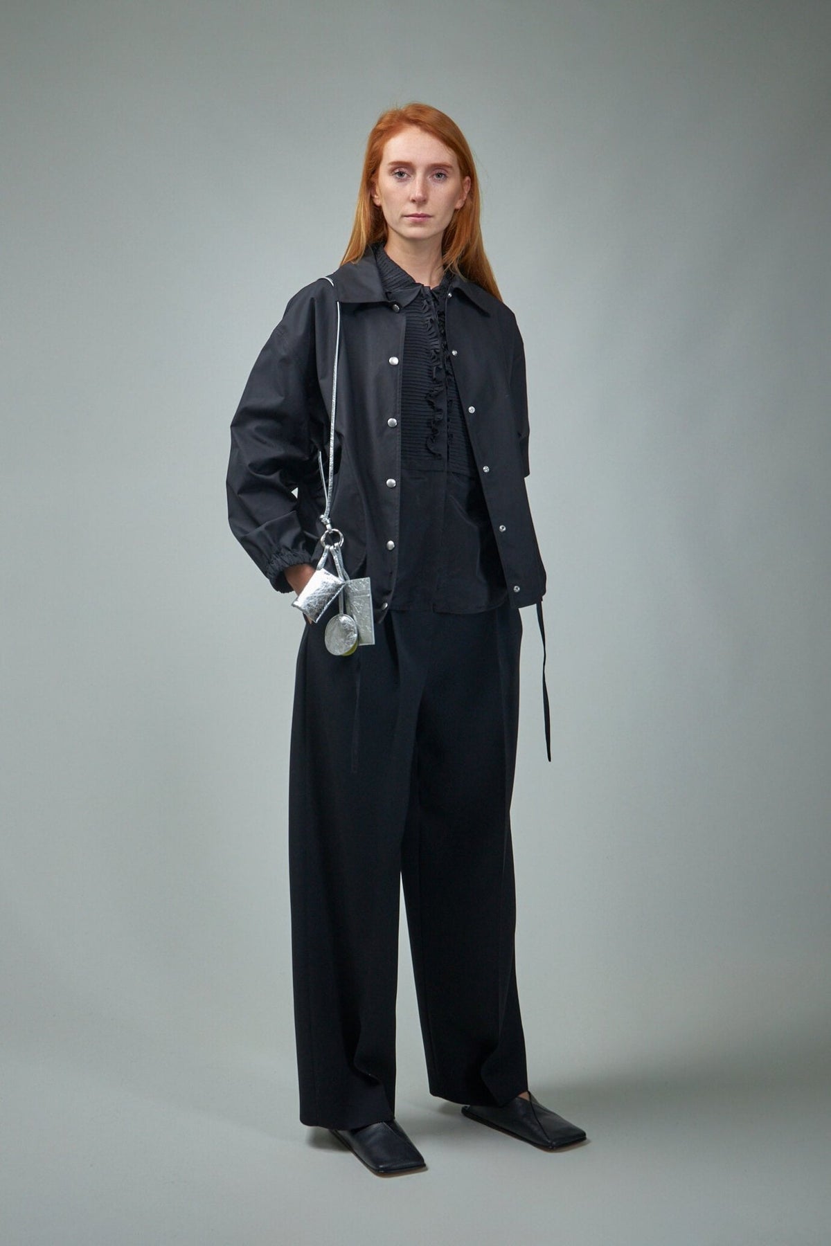 Close-up view of Jil Sander shirt showing button closure and collar detail