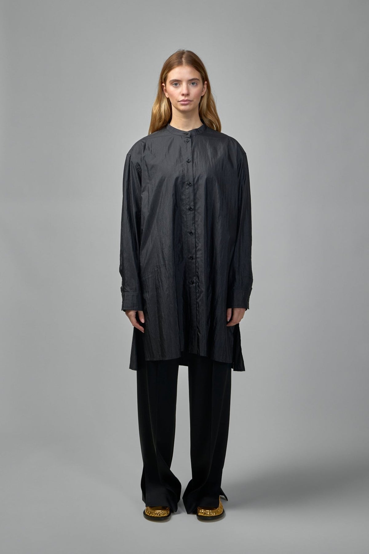 Close-up detail of crinkled wool poplin fabric texture on Jil Sander shirt