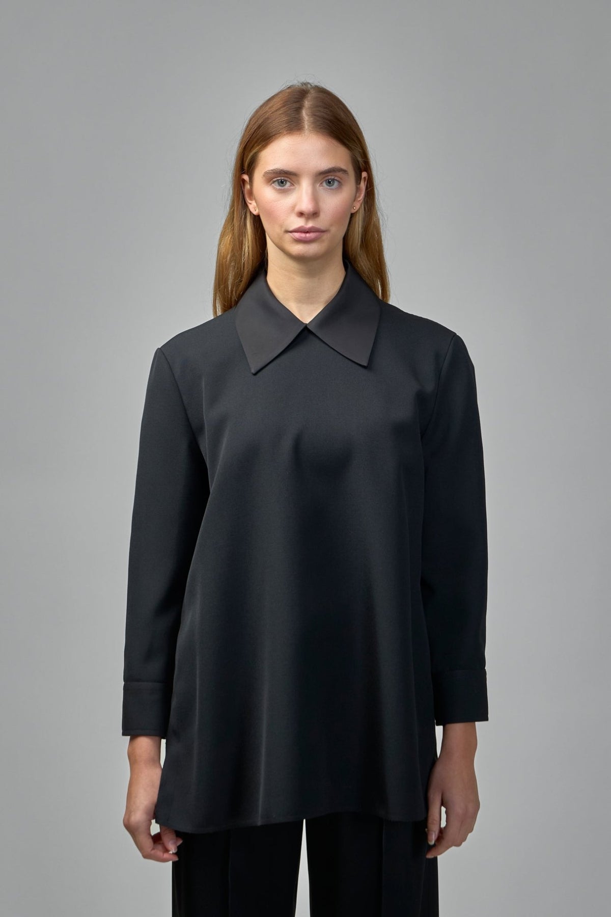 Close-up of premium wool texture and pointed collar detail on Jil Sander blouse