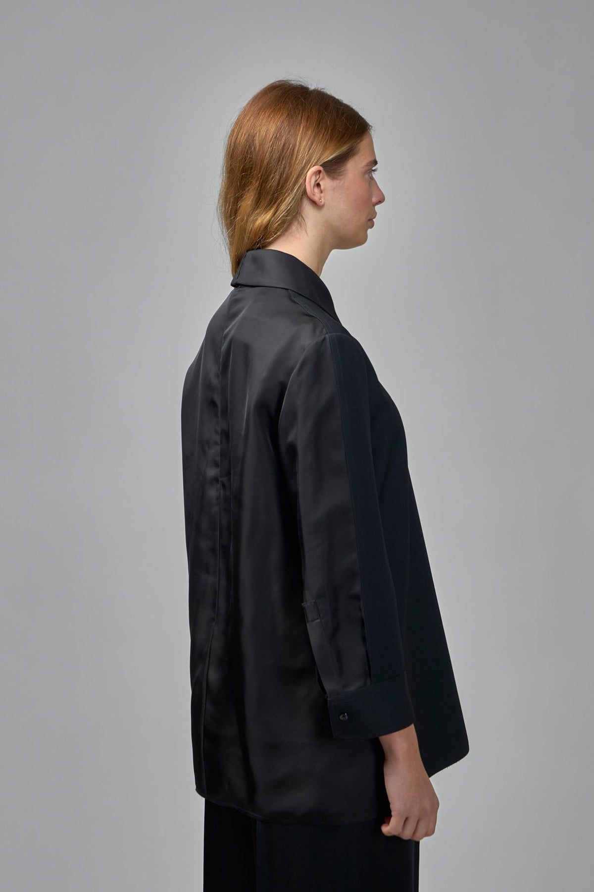 Model wearing Jil Sander wool top showing loose fit and long sleeves