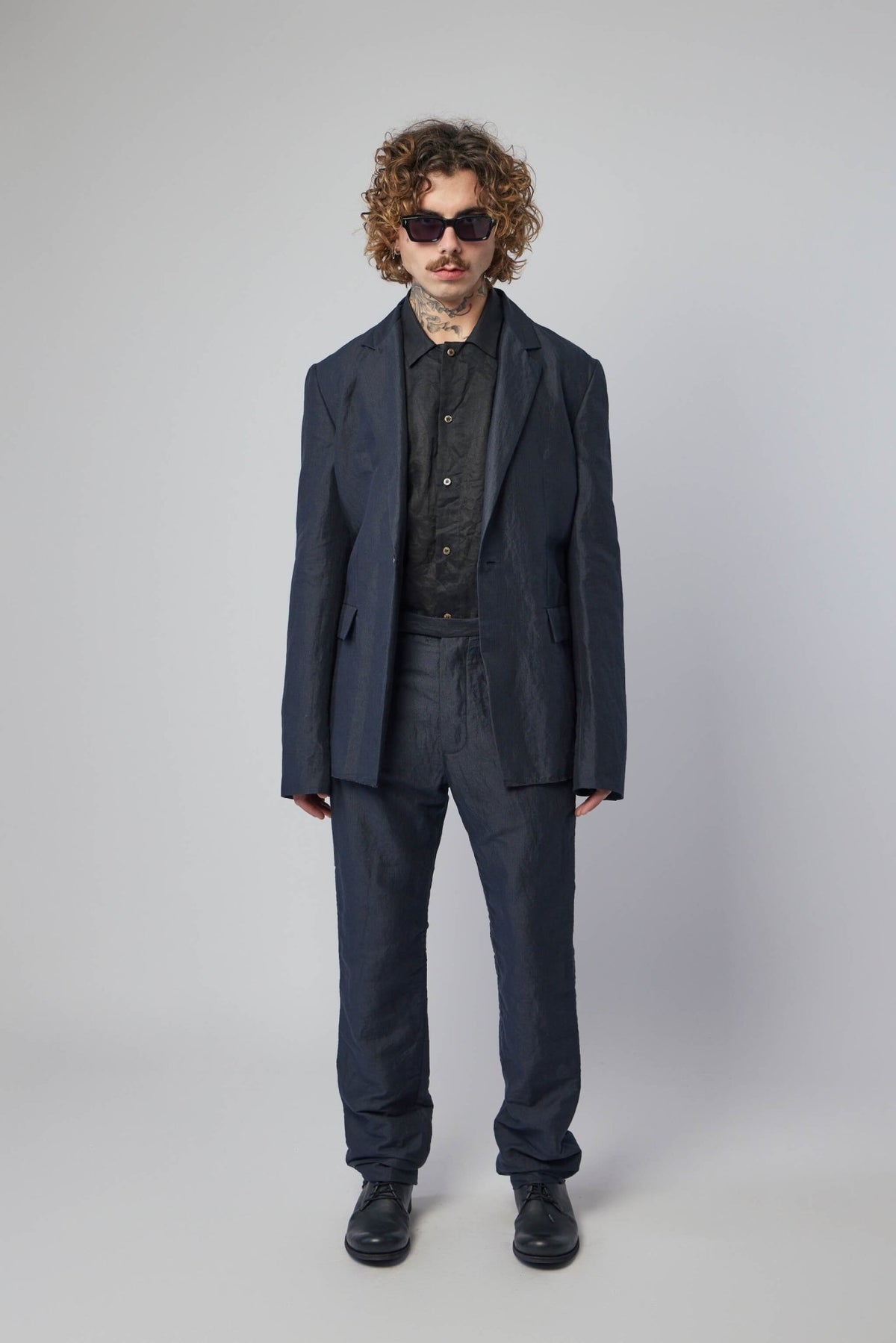 Side view of K'ang fitted trousers highlighting the true-to-size tailored fit, view 6