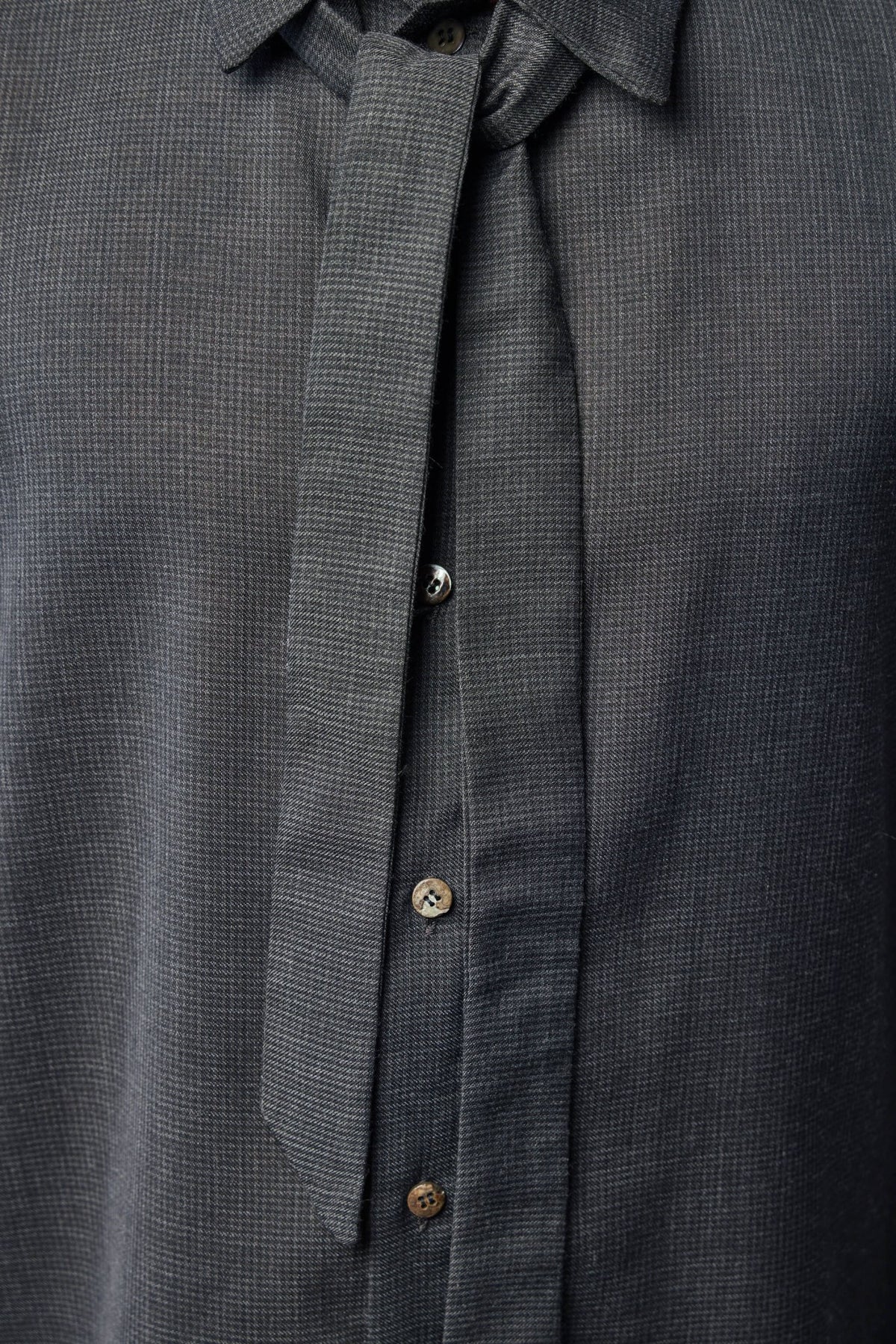 K'ANG shirt collar and tie detail showcasing sophisticated tailoring