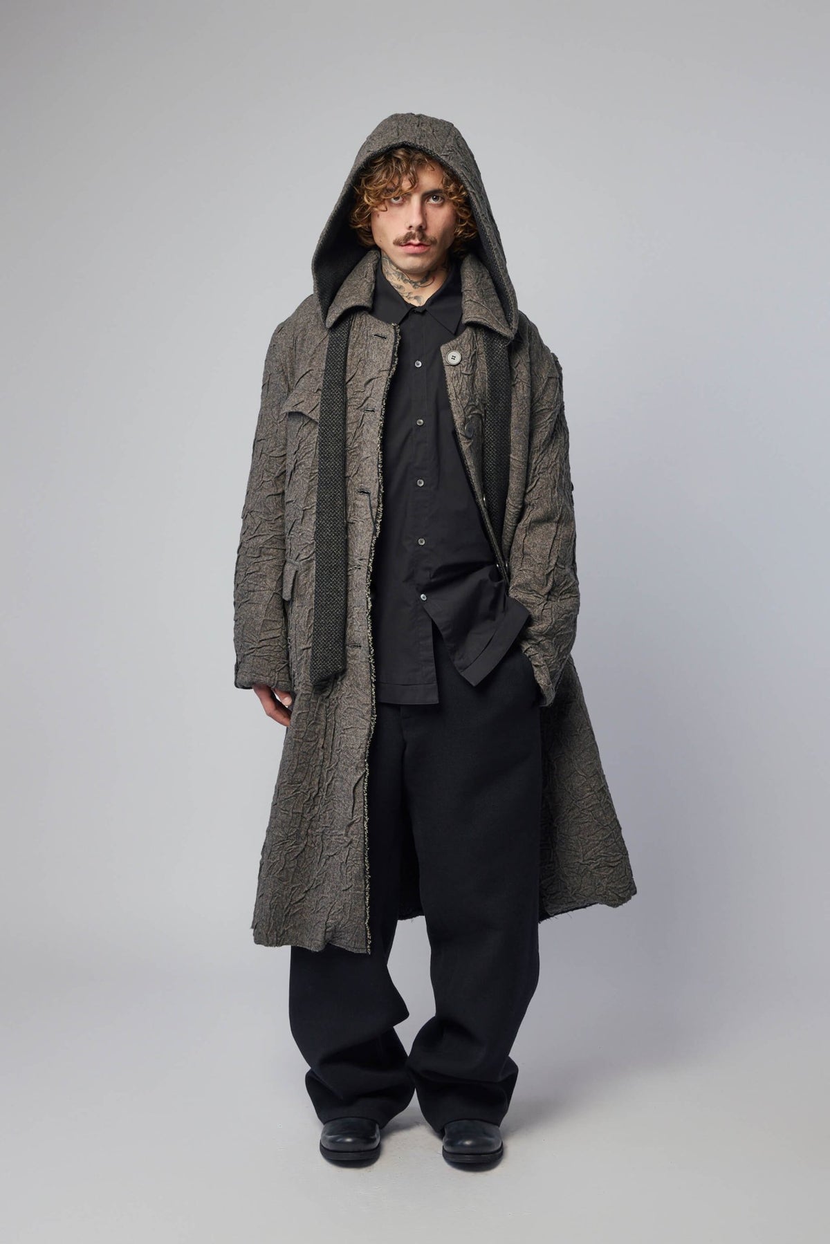 Back view showing adjustable pleat mechanism on K'ANG trousers