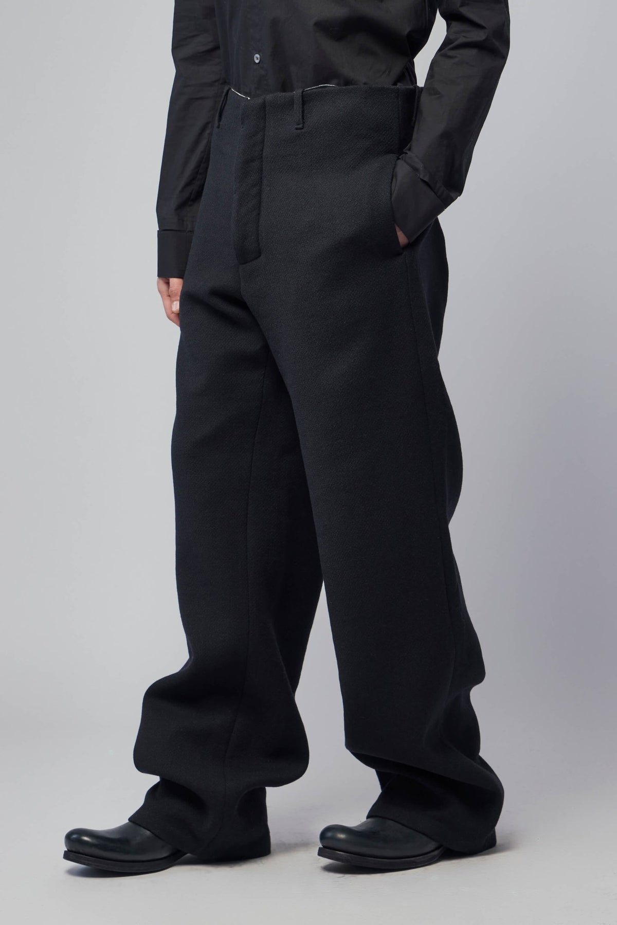 Model wearing K'ANG wide-leg pants showing full silhouette