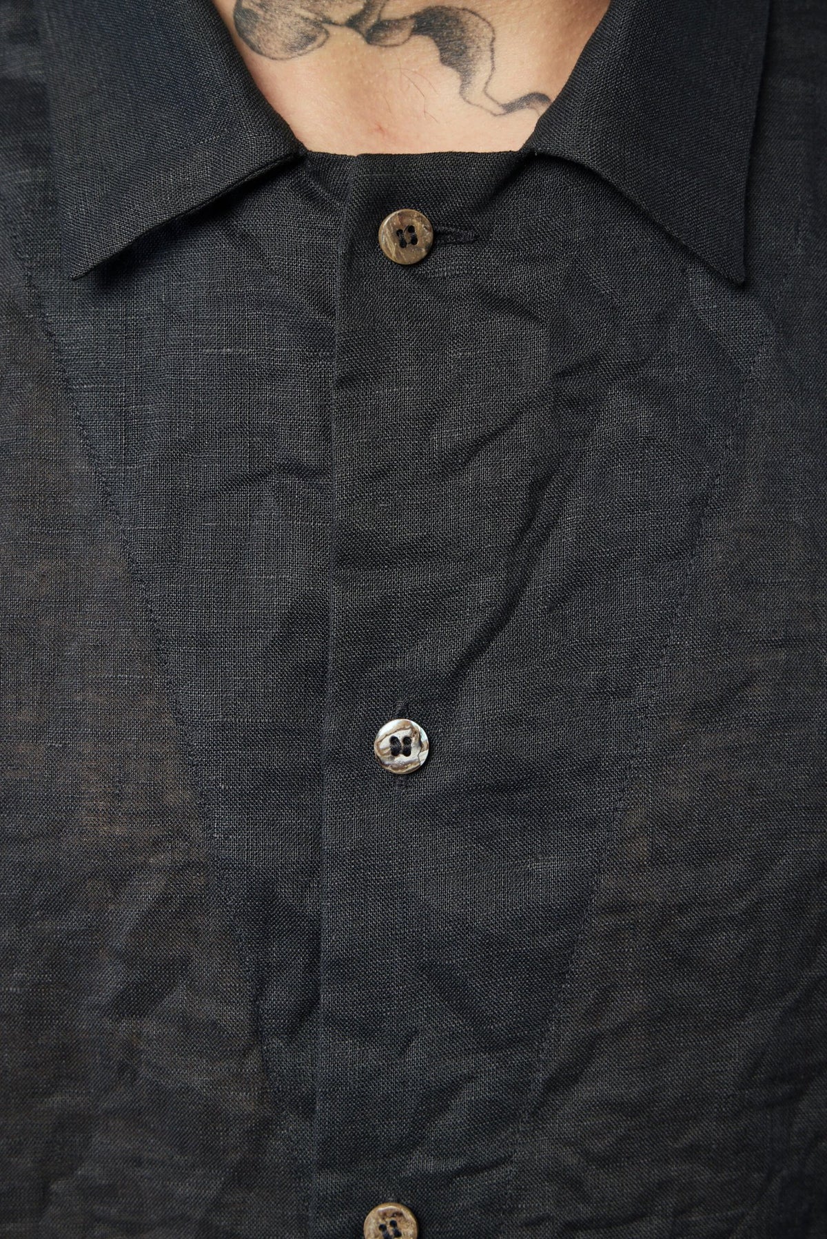 Back view of K'ang linen shirt showcasing tailored fit and premium construction