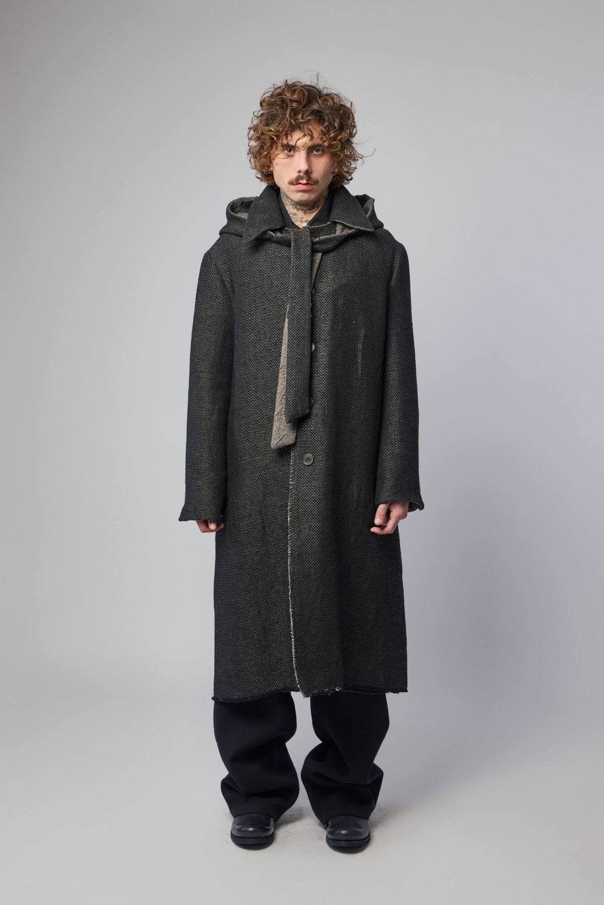 Close-up detail of reversible coat construction showing wool and cotton blend texture
