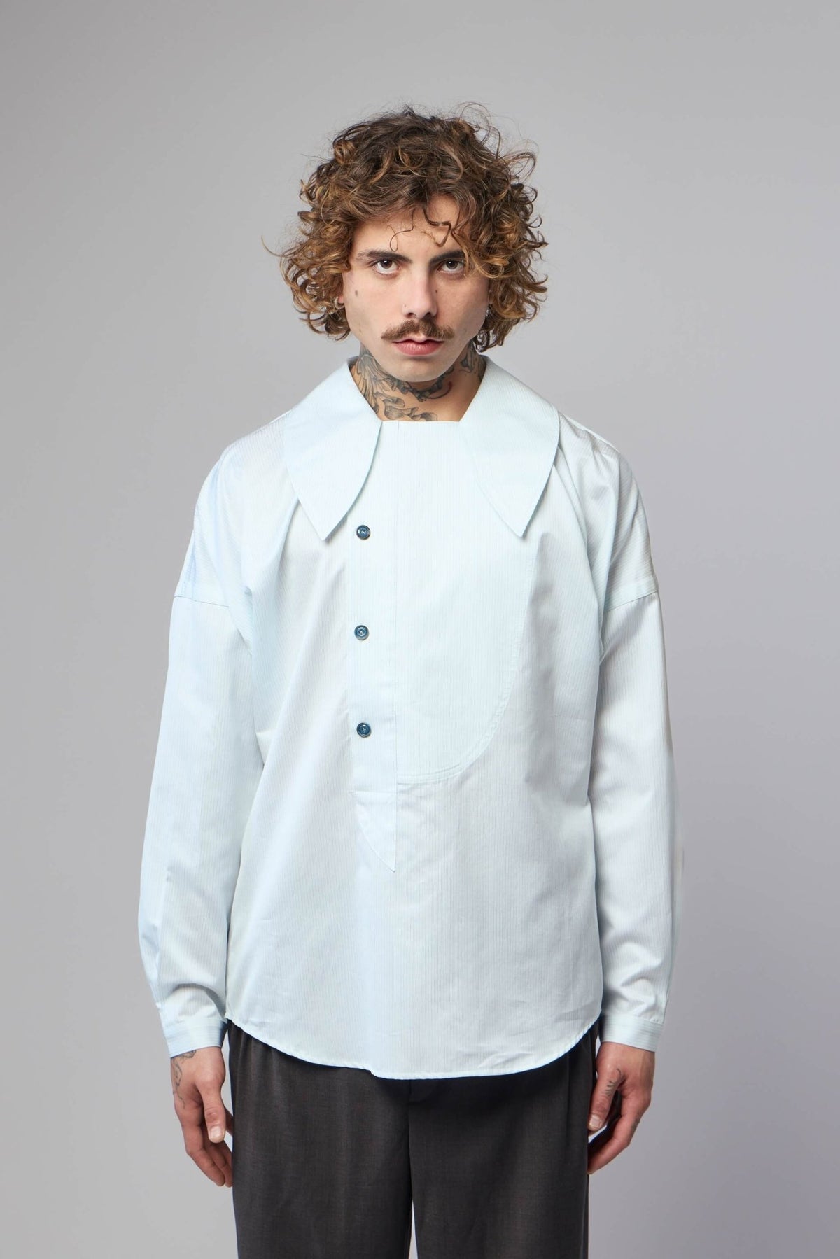 Close-up detail of double stripe pattern on Kiko Kostadinov Kest shirt