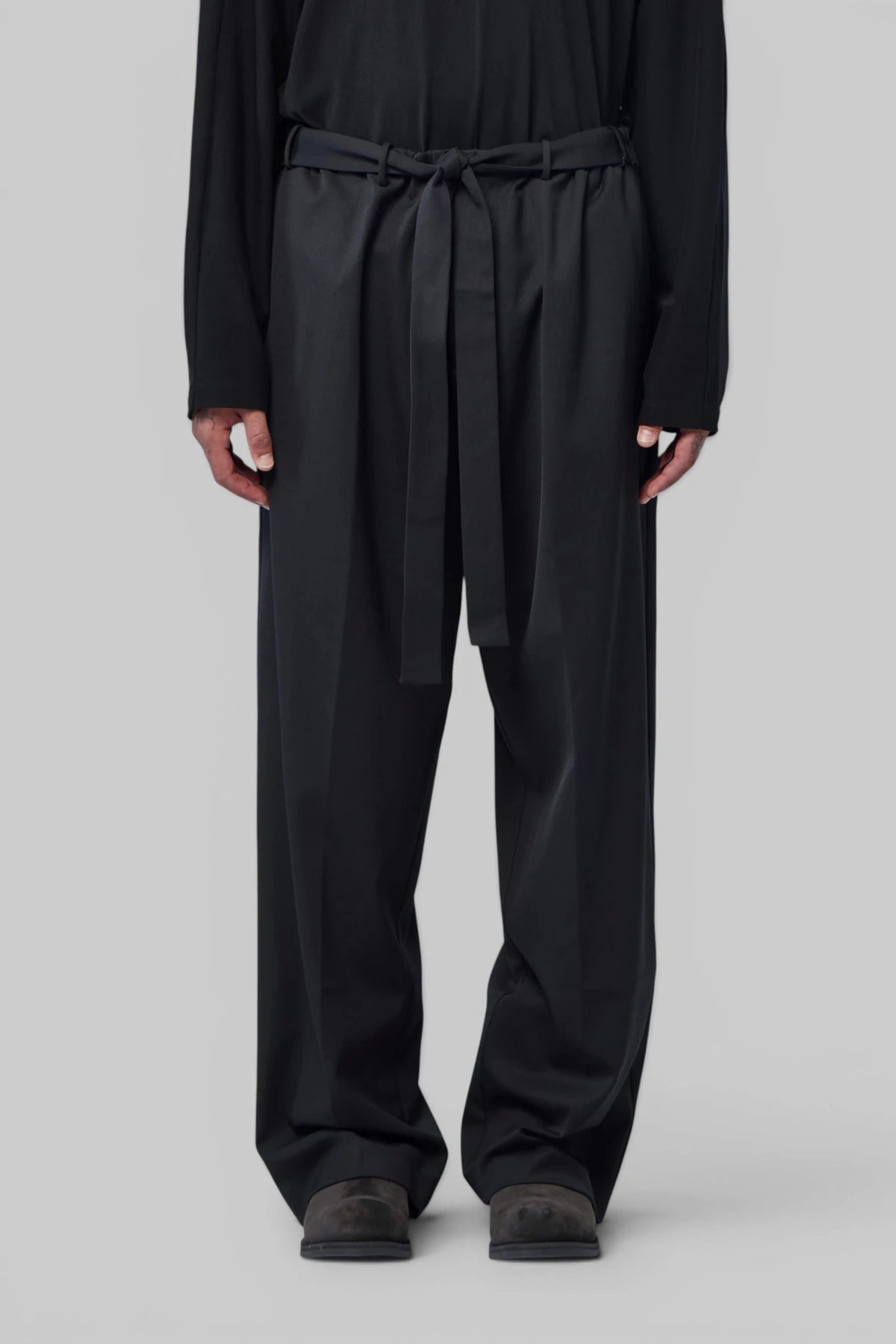 Wool wide-leg trousers by Kiko Kostadinov styled with knitwear