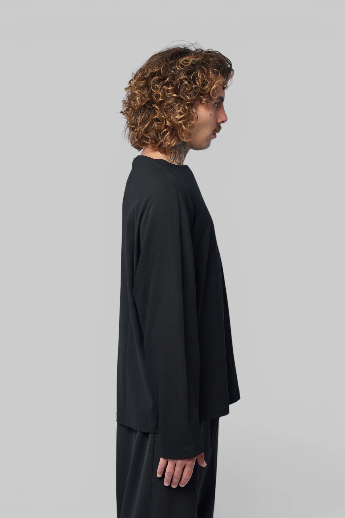 Model wearing Tomelilla Top with straight hemline