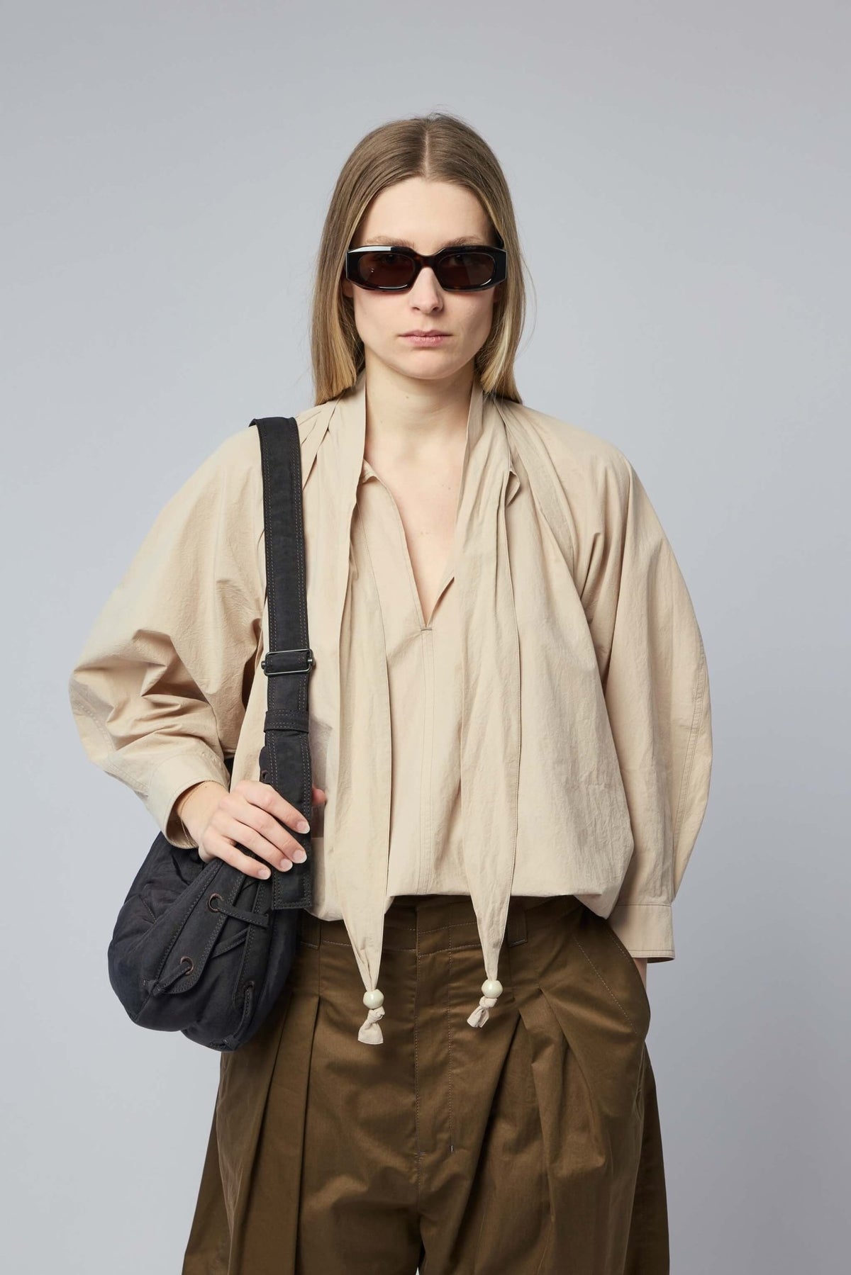 Lemaire blouses in cotton with attached scarf detail on model