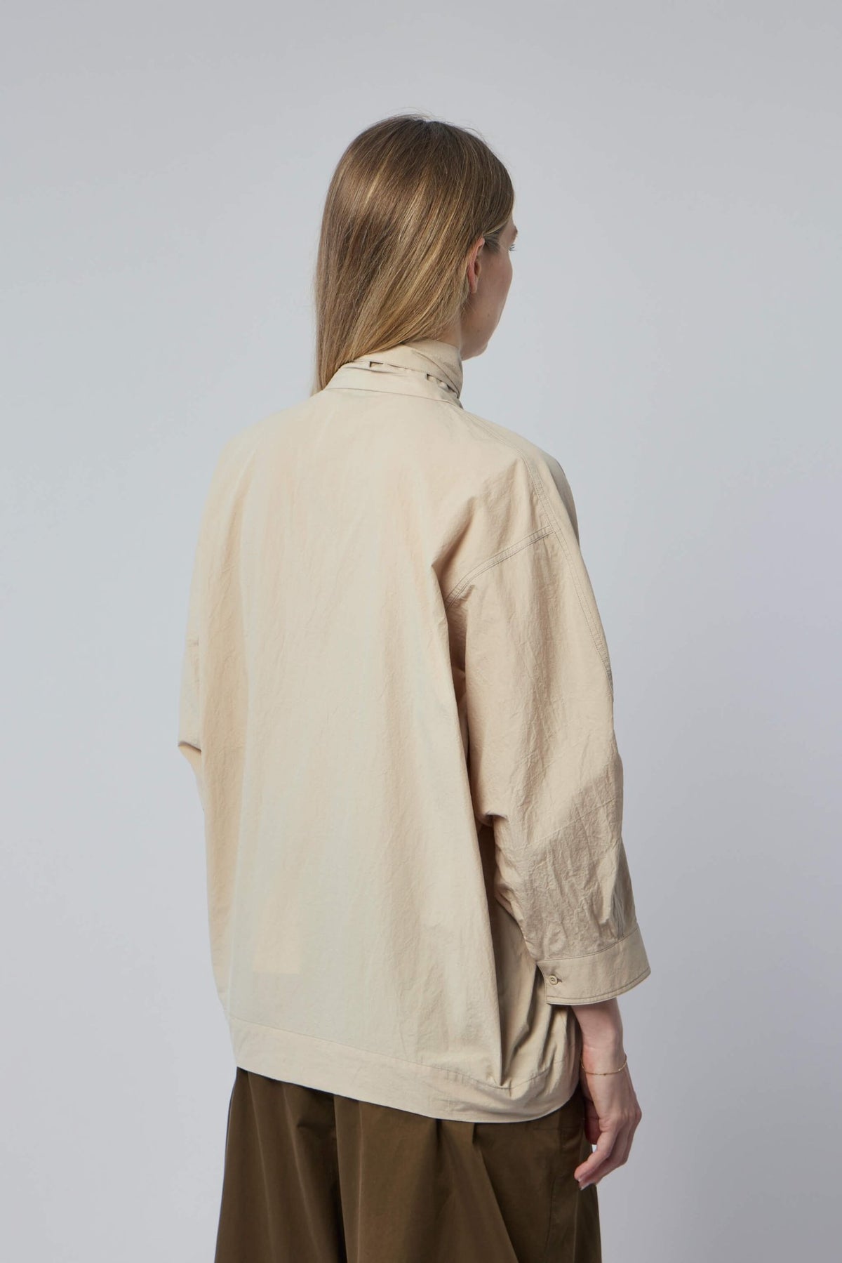 Back view of Lemaire blouse with scarf styling