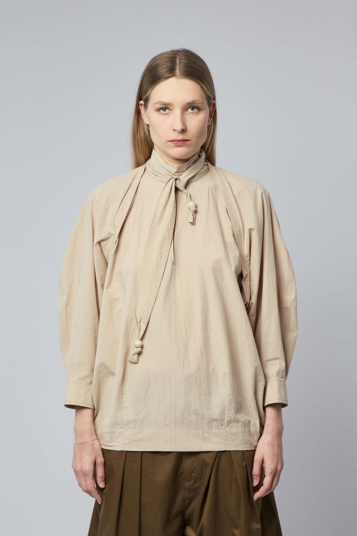 Close-up of Lemaire cotton blouse showing scarf construction
