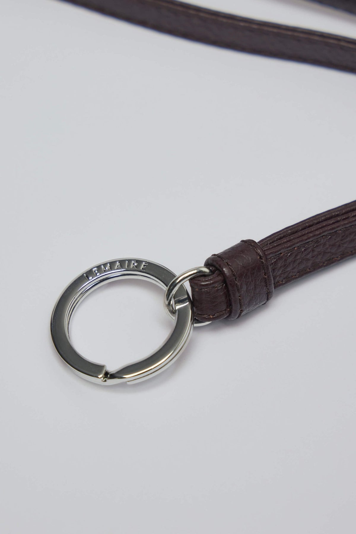 Detail shot of textured leather finish on Lemaire croissant purse