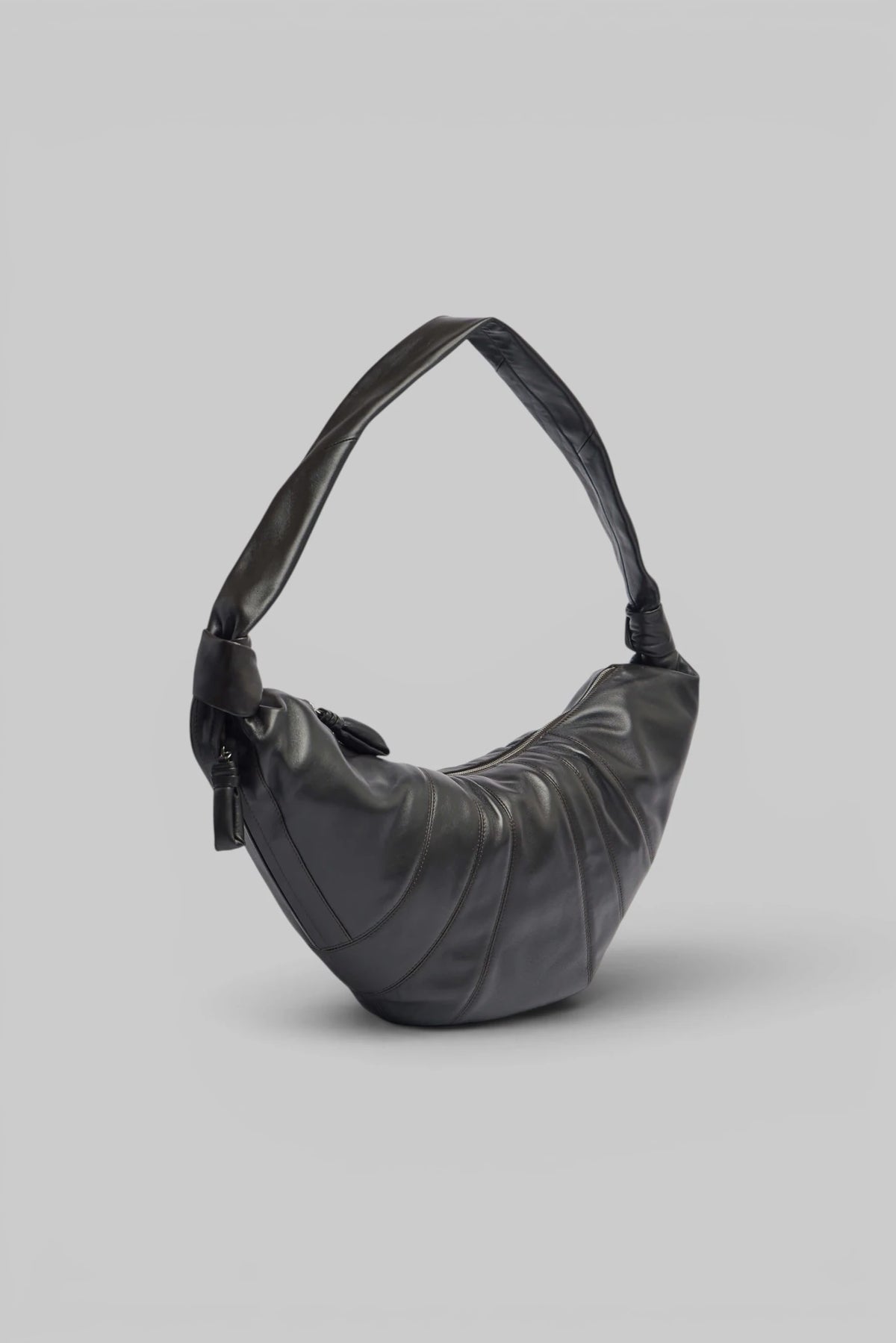 Close-up of stitched panel detailing on Lemaire Croissant Bag