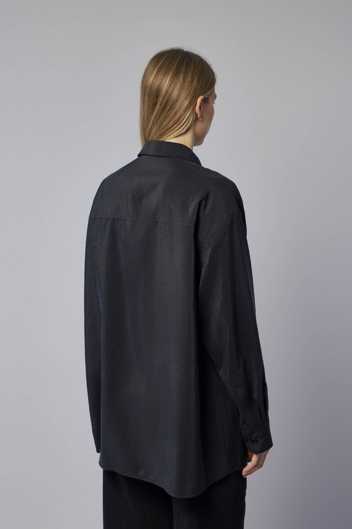 Lemaire shirt styled with wide-leg trousers for elegant look
