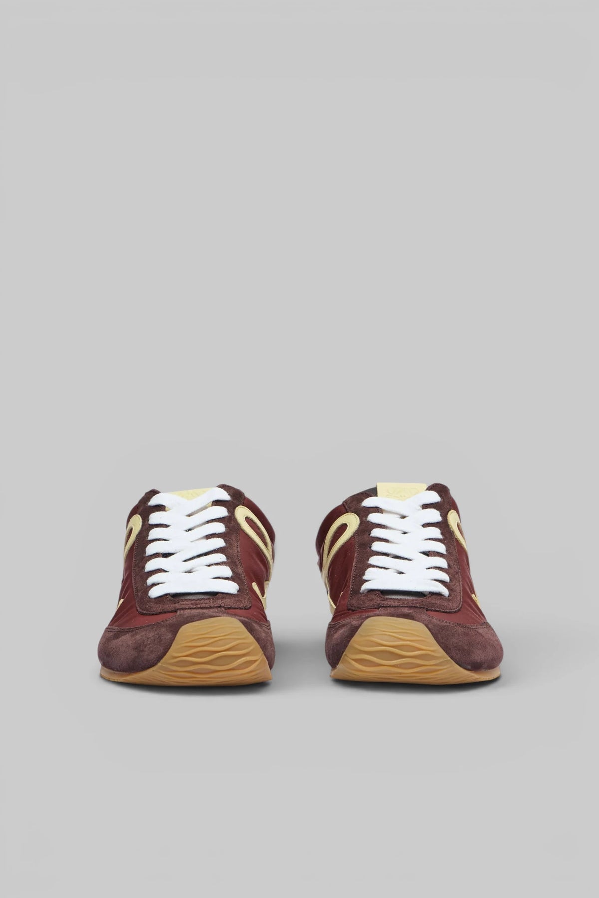 Side view of Loewe Ballet Runner 2.0 sneakers showing elegant silhouette