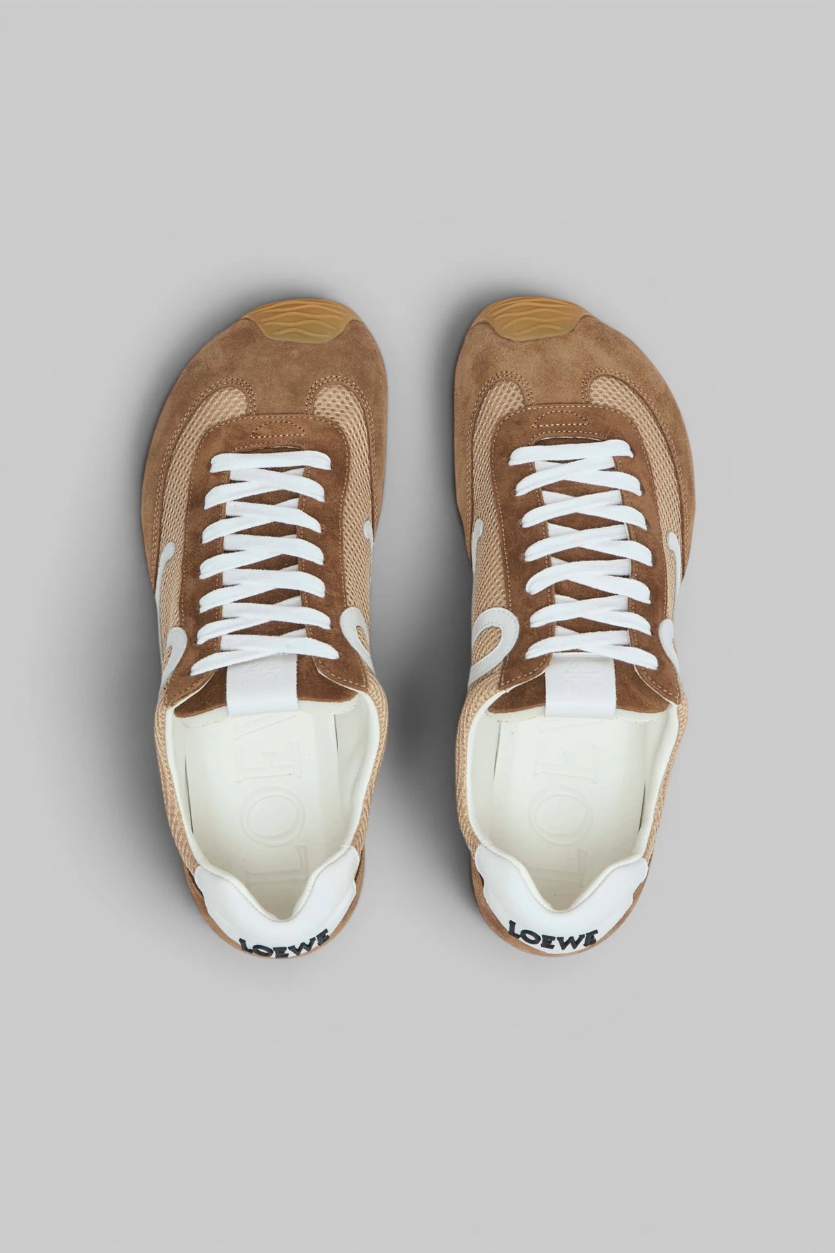 Detail shot of mesh and calfskin upper with white laces