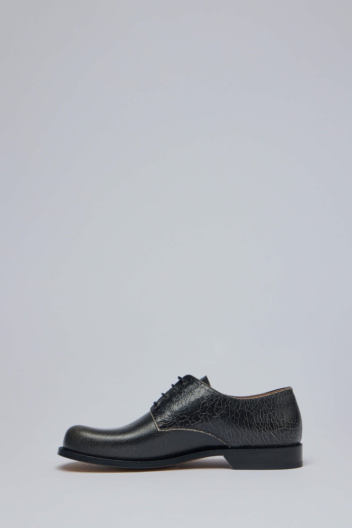 Detail shot of textured calfskin leather on Loewe Campo Derby shoes