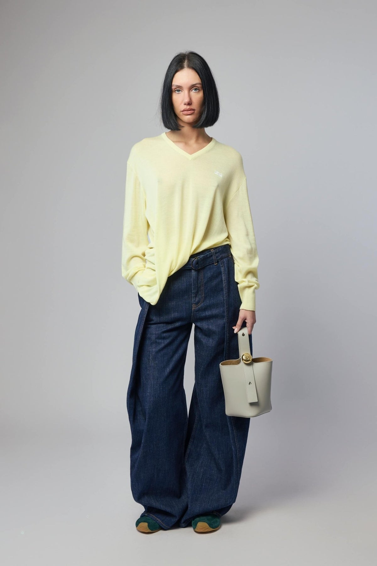 Full outfit styling with Loewe draped sweater and accessories