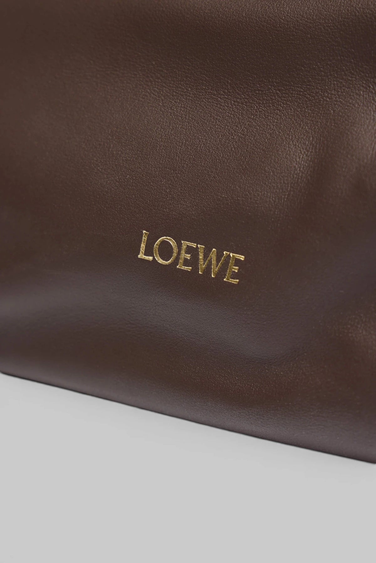 Detail shot of calf leather texture on Loewe Flamenco Clutch