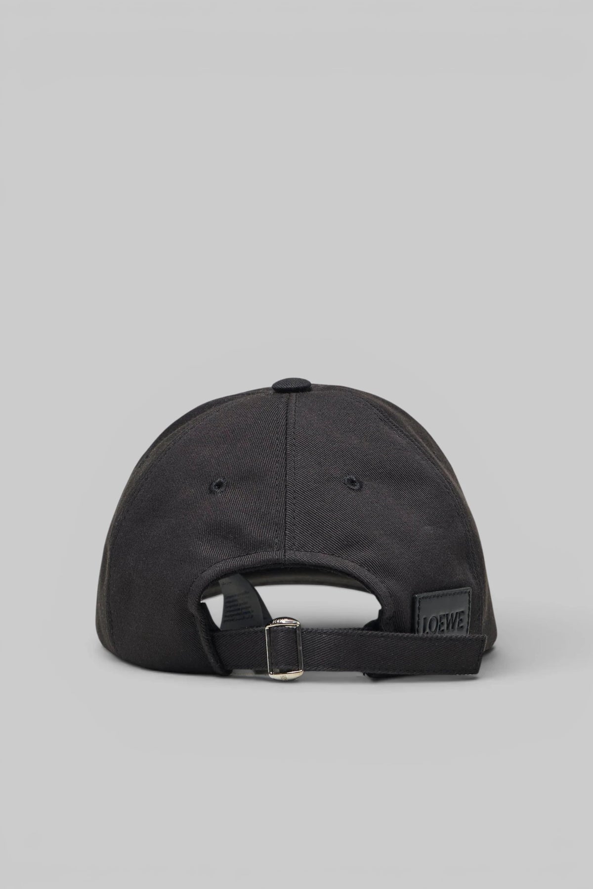 Close-up of embroidered branding on the Loewe Cap