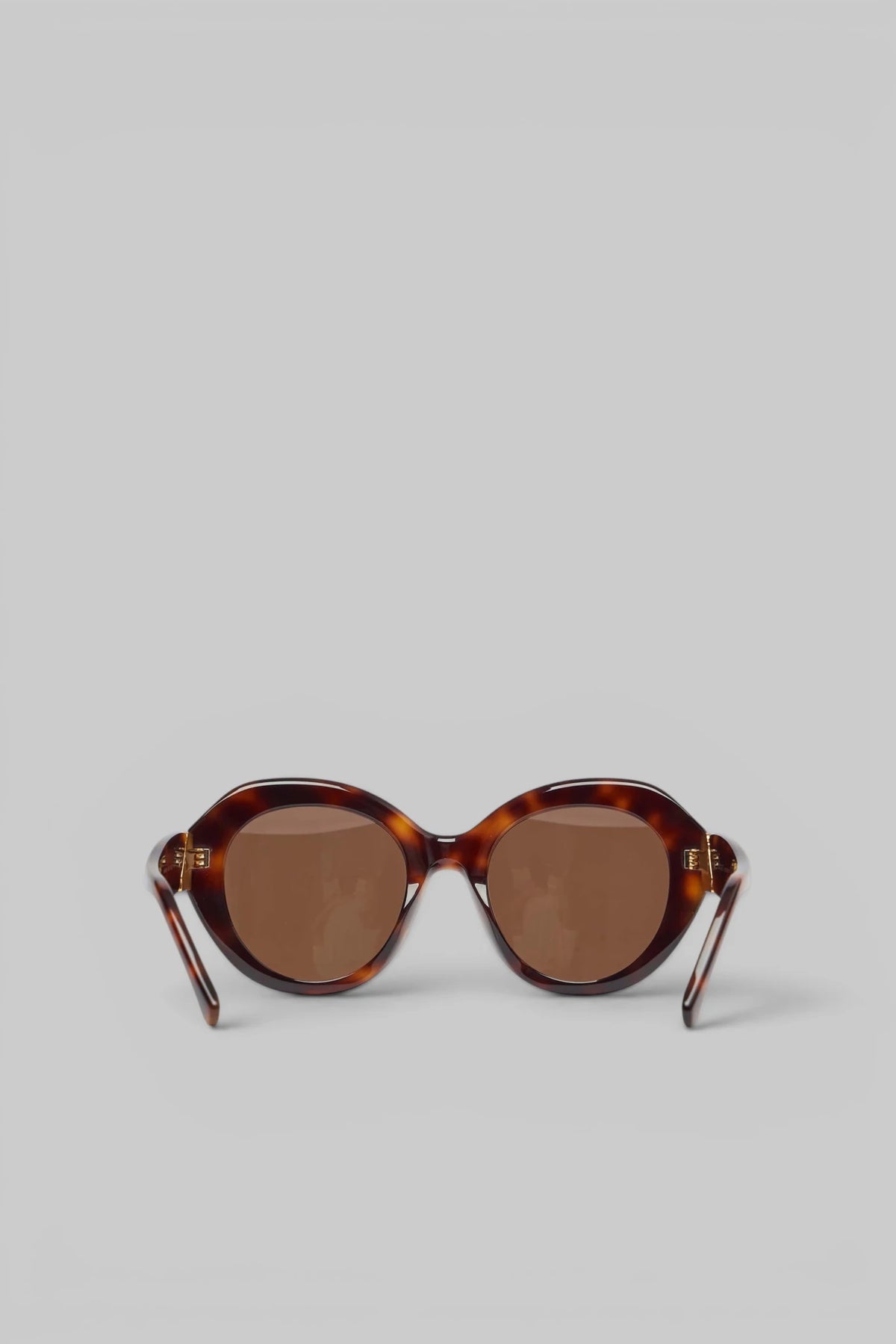 Model wearing Loewe Small Butterfly Screen Sunglasses outdoors
