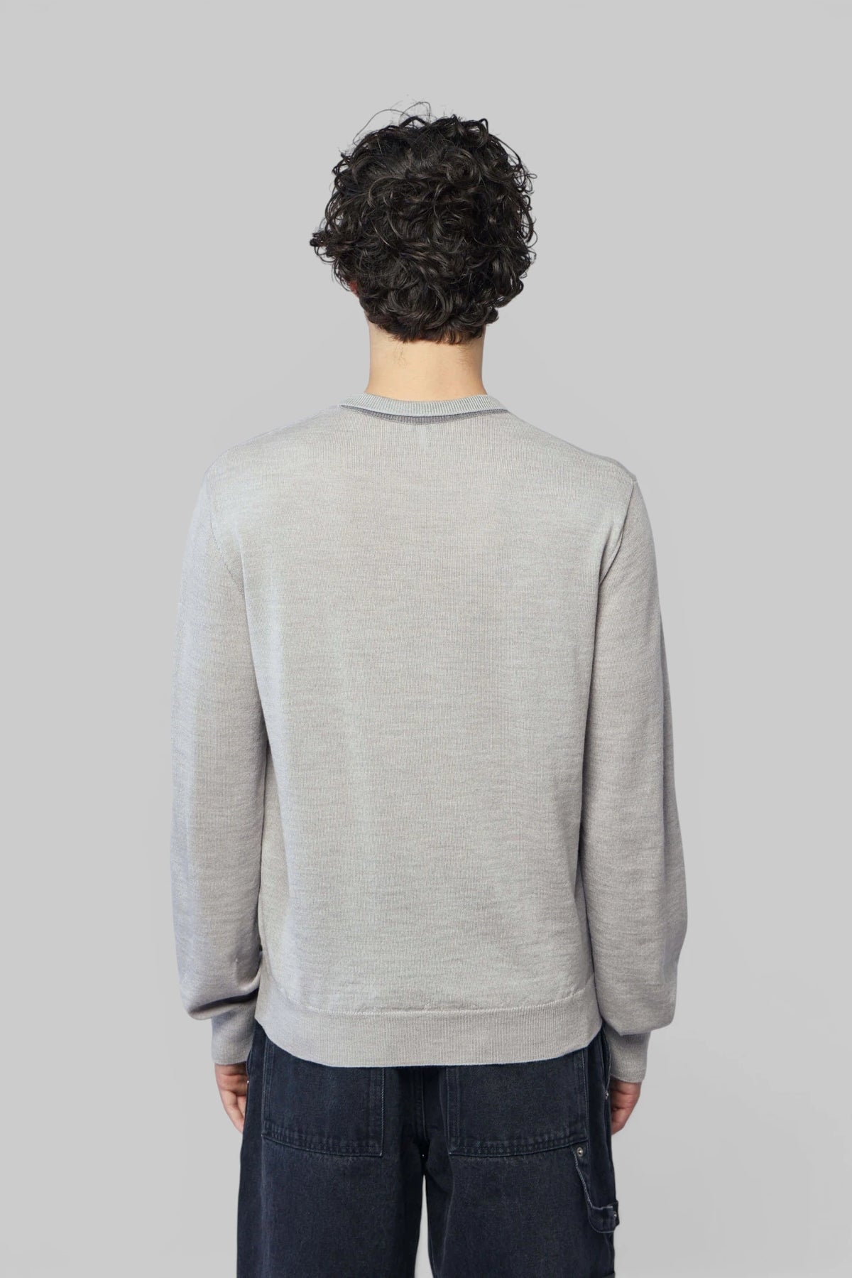 Model wearing Loewe crew neck sweater in light grey wool, view 5