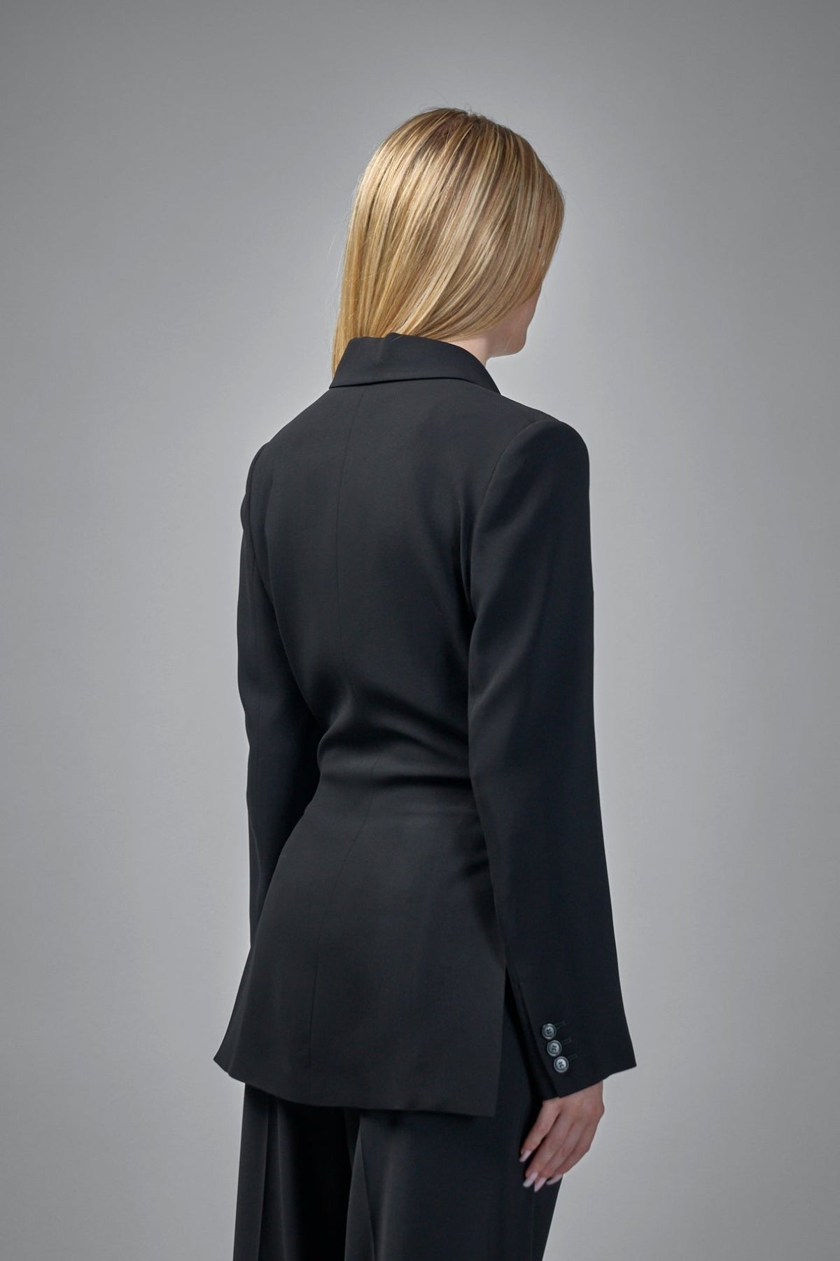 Side view showing fitted waist structure of Loewe blazer