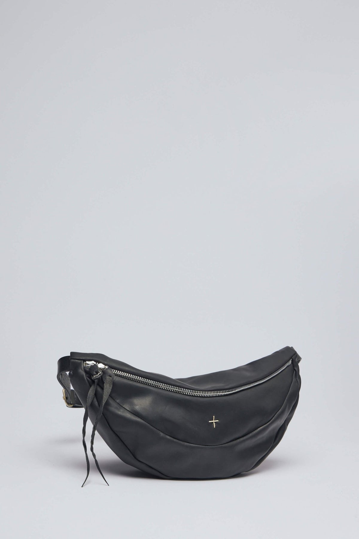 Close-up view of the avant-garde slice detailing on M.A+ crossbody bag
