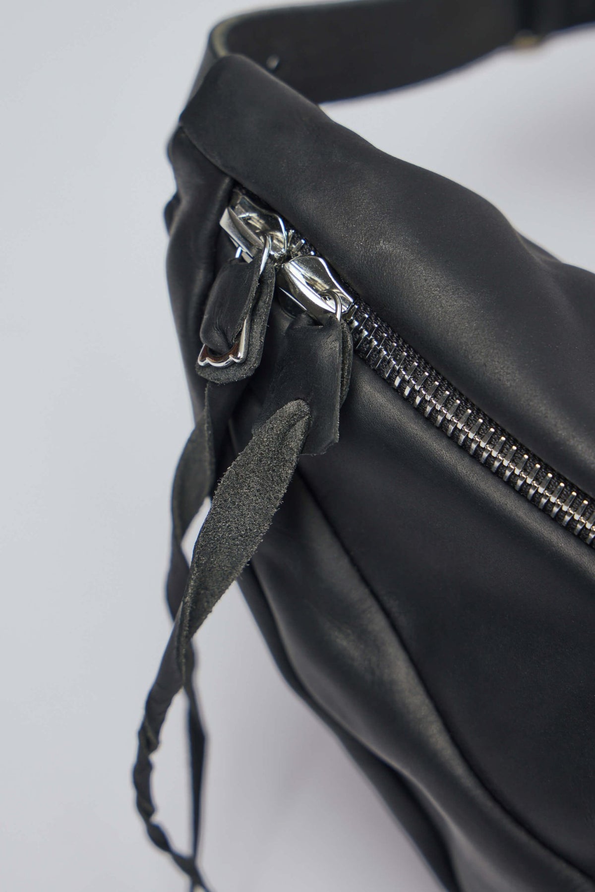 Side profile showing the architectural construction of M.A+ leather bag