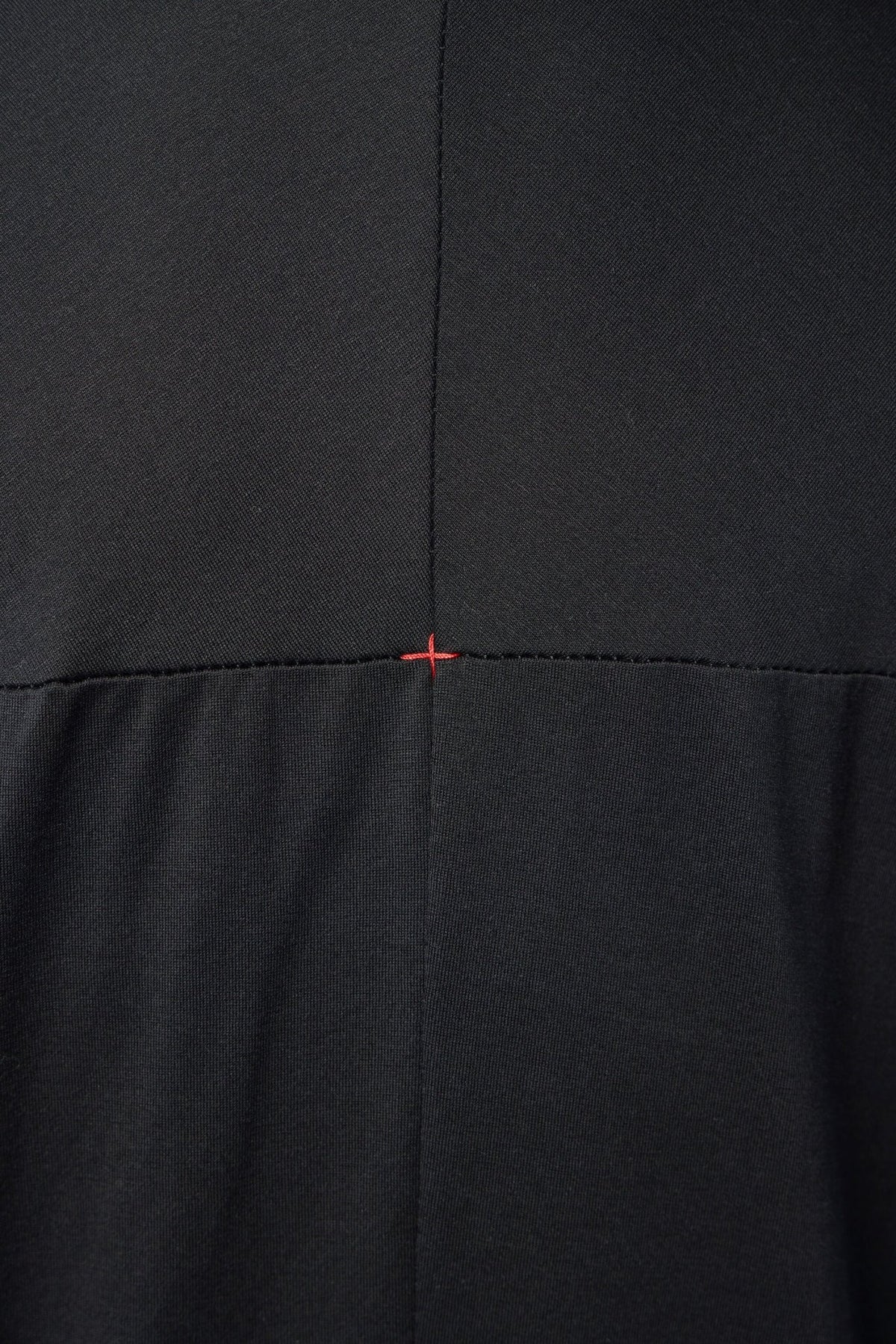 Back view of avant-garde cotton t-shirt showcasing architectural silhouette