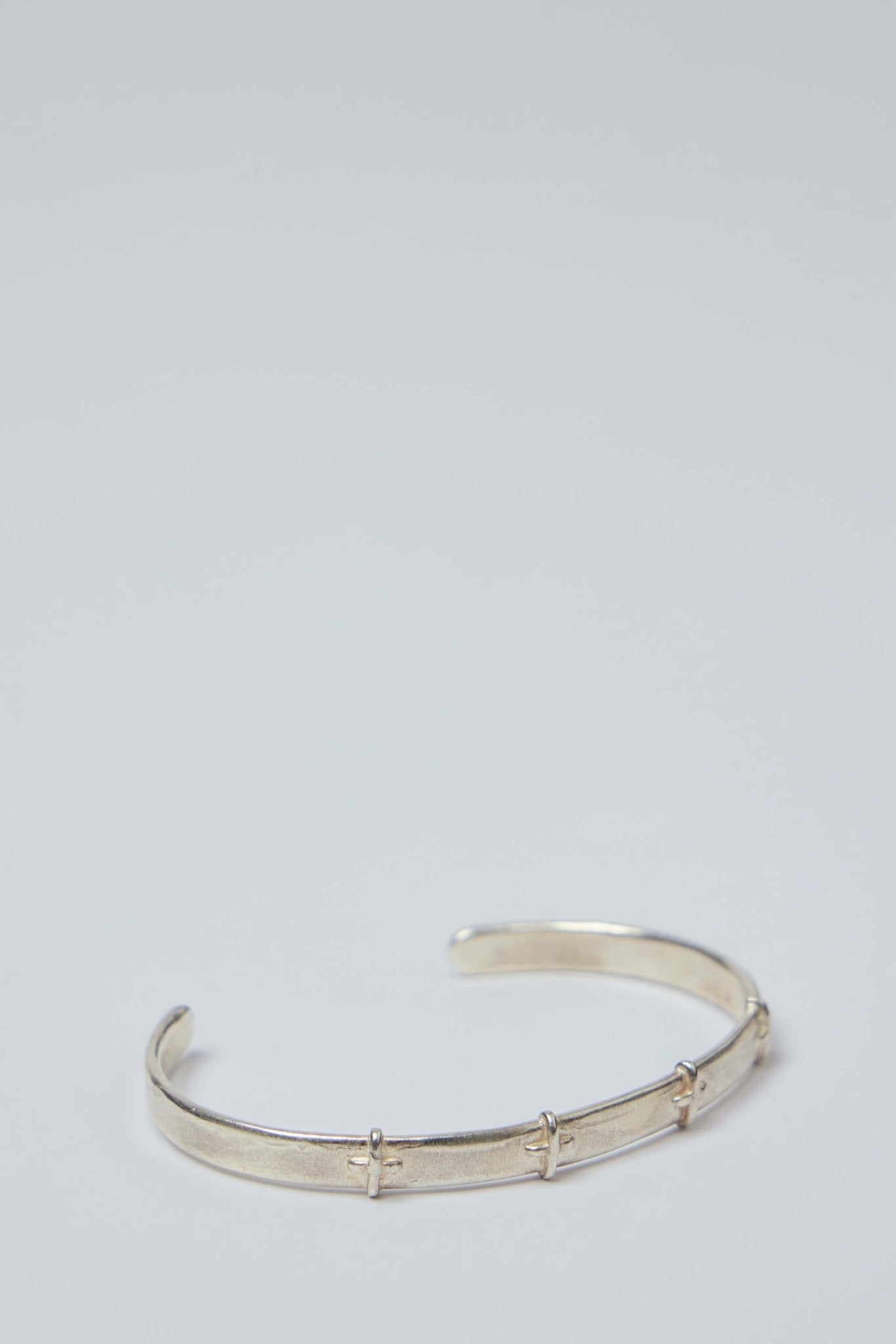 M.A+ Maurizio Amadei - Thin Silver Stitched Cross Silver Bangle - LABELS