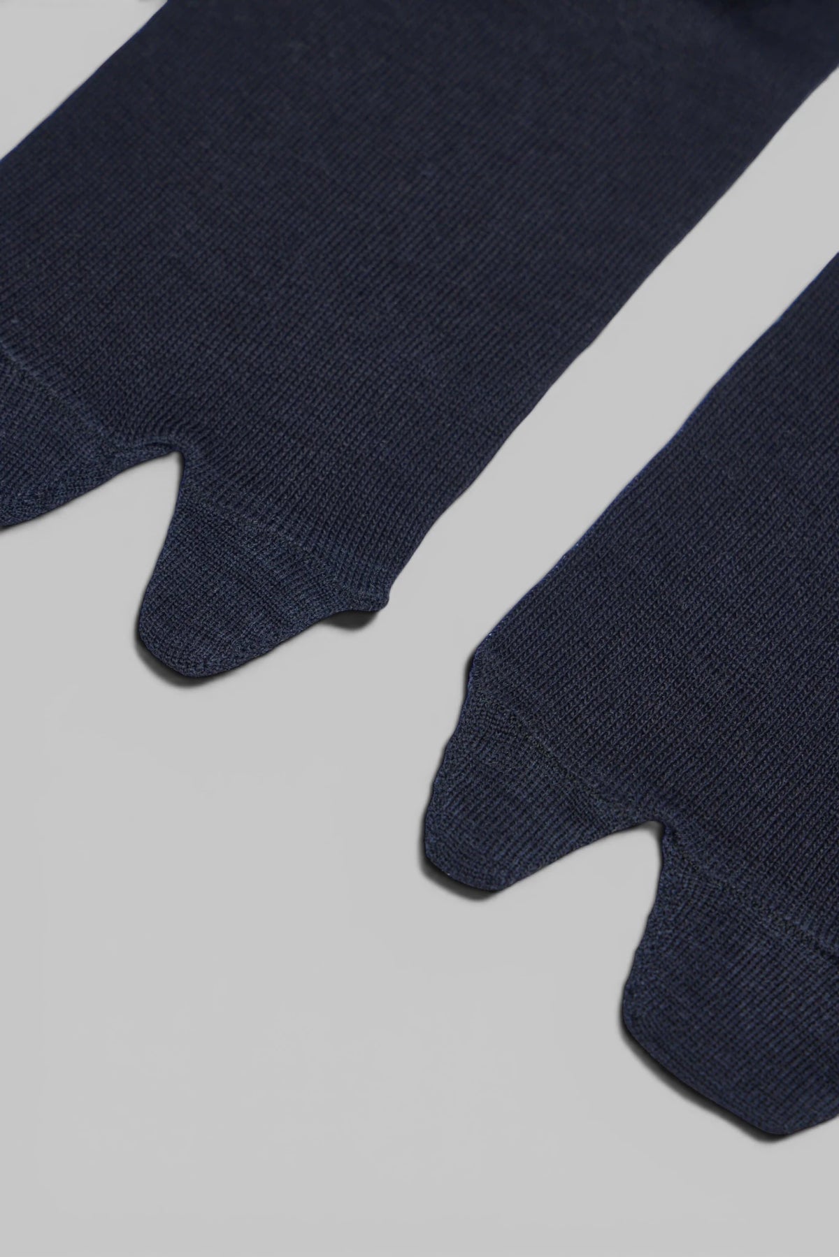 Maison Margiela knee-high socks styled with footwear