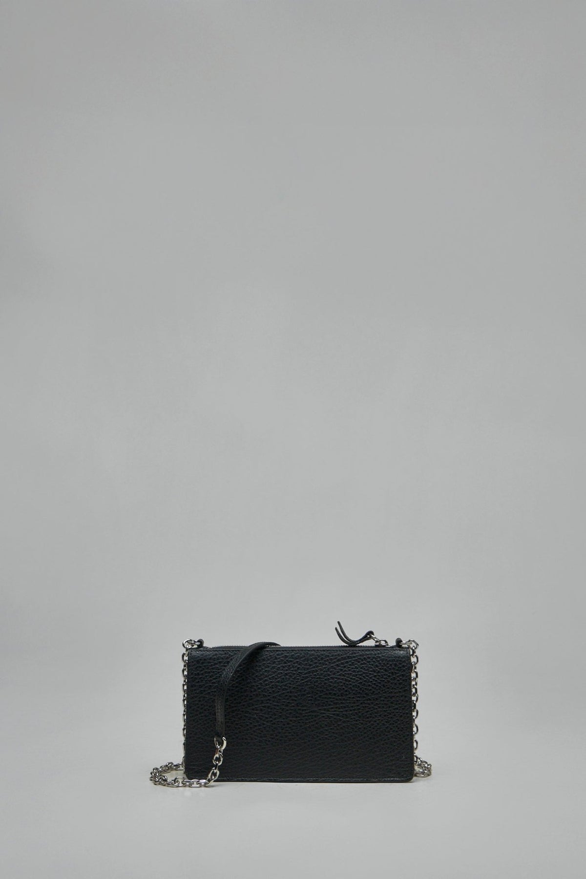 Close-up of Maison Margiela chain link wallet showing signature white stitch details