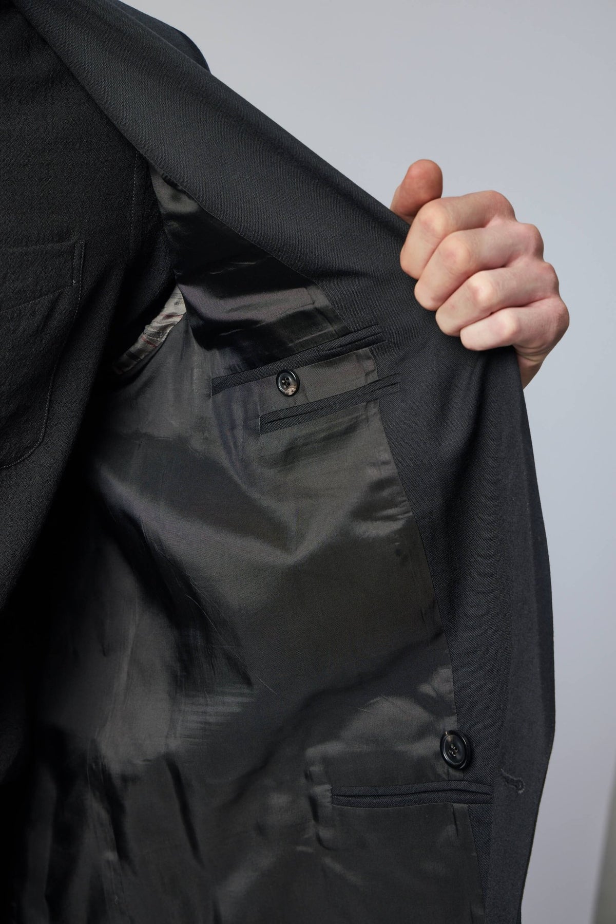 Side view of deconstructed blazer silhouette and design details, view 7