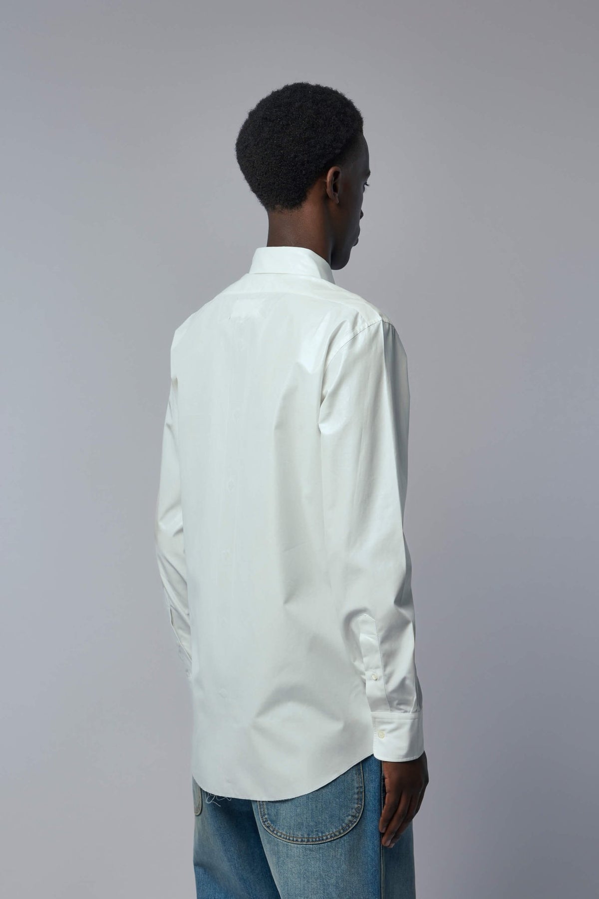 Detail shot of Maison Margiela shirt collar and button craftsmanship