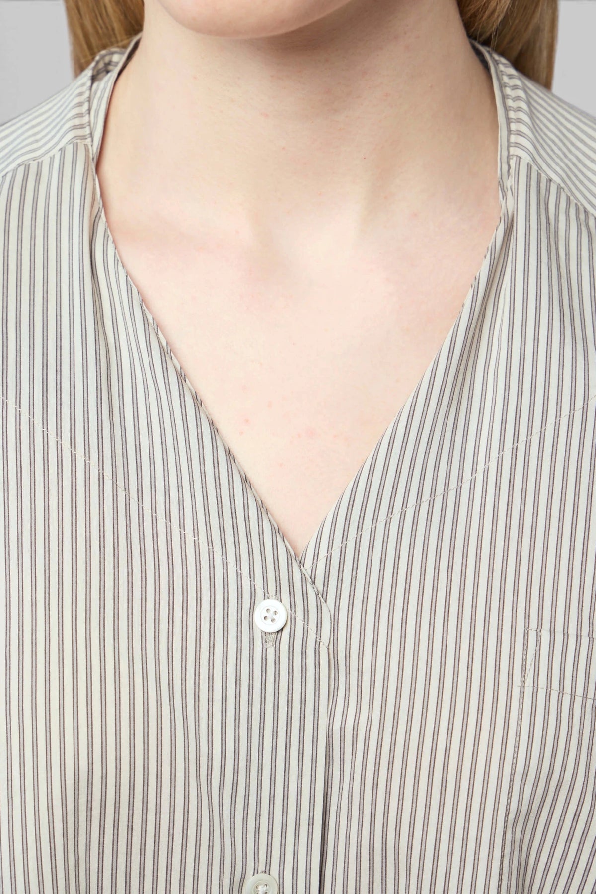 Maison Margiela shirt back view showing rounded hemline